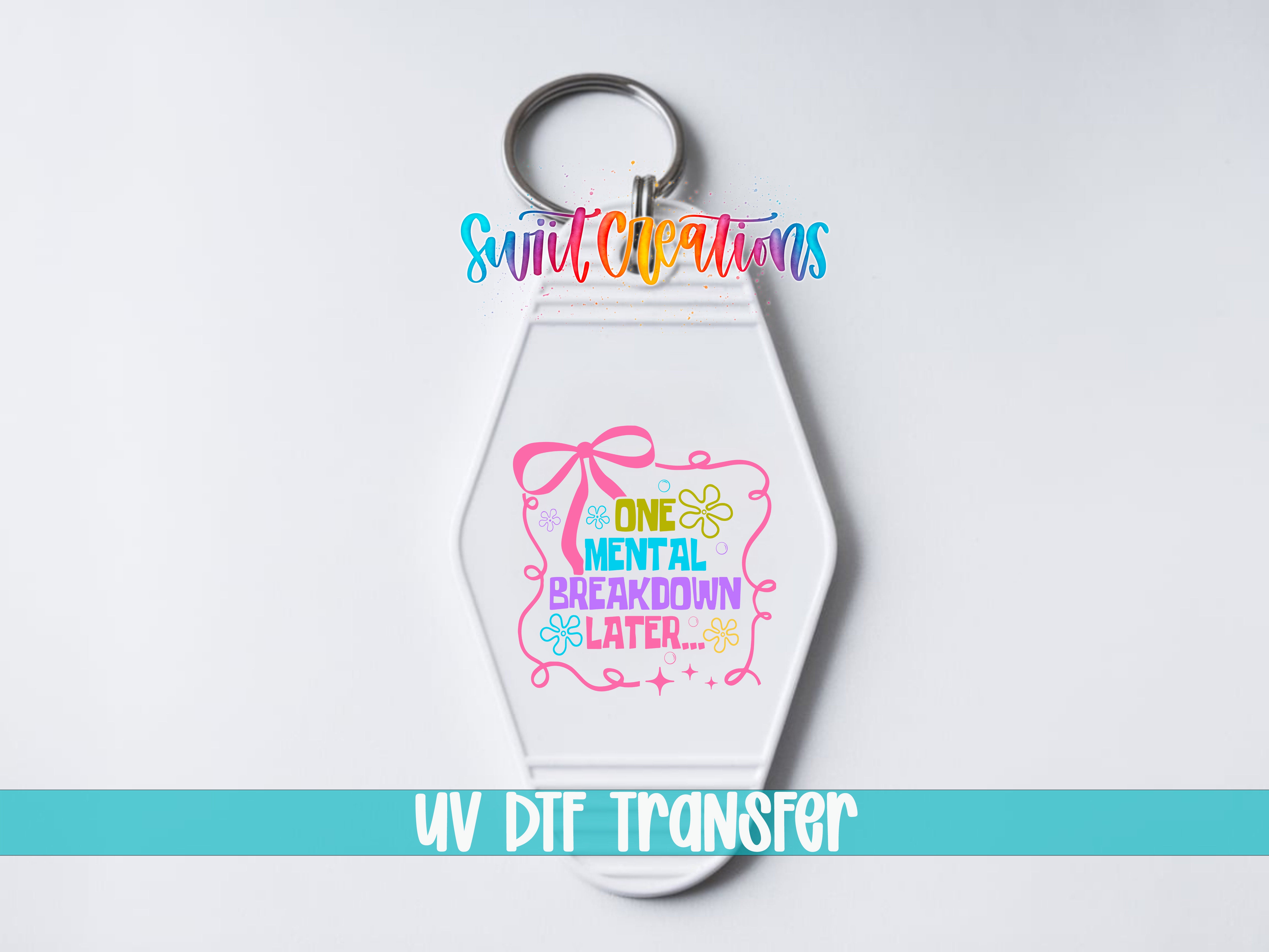 A keychain with a colorful design and text on it, along with the text "Sunlit Creations" and "UV DDF Transfer" at the bottom.