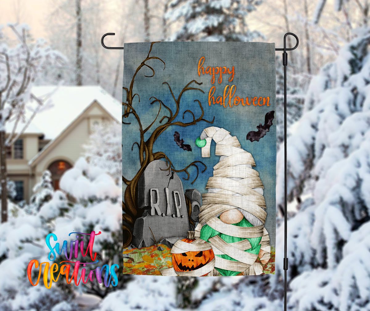 A Halloween-themed garden decoration featuring a gnome wrapped in bandages, a carved pumpkin, and a gravestone with the word "RIP" on it, all set against a snowy background.