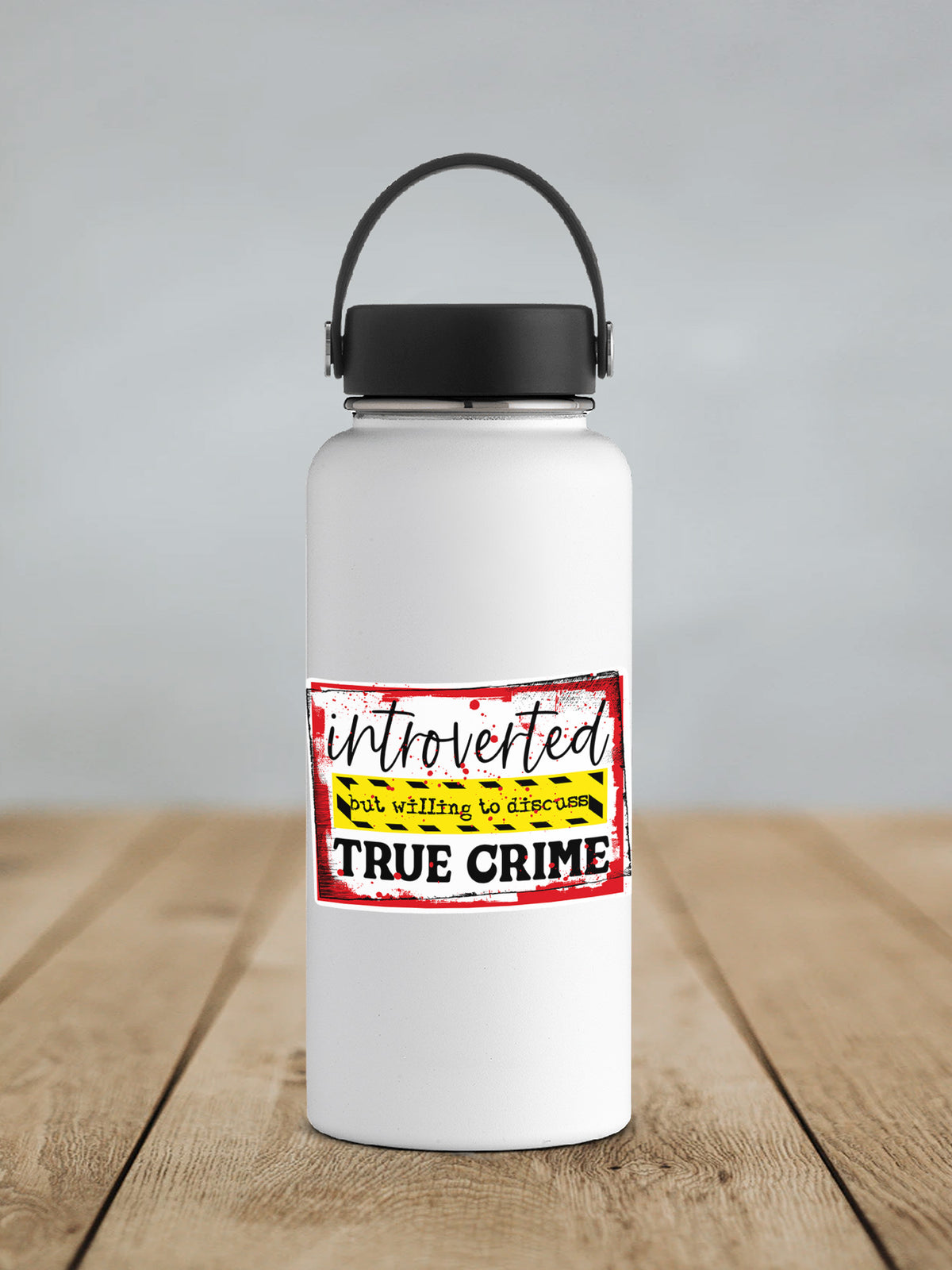 a white water bottle sitting on top of a wooden table