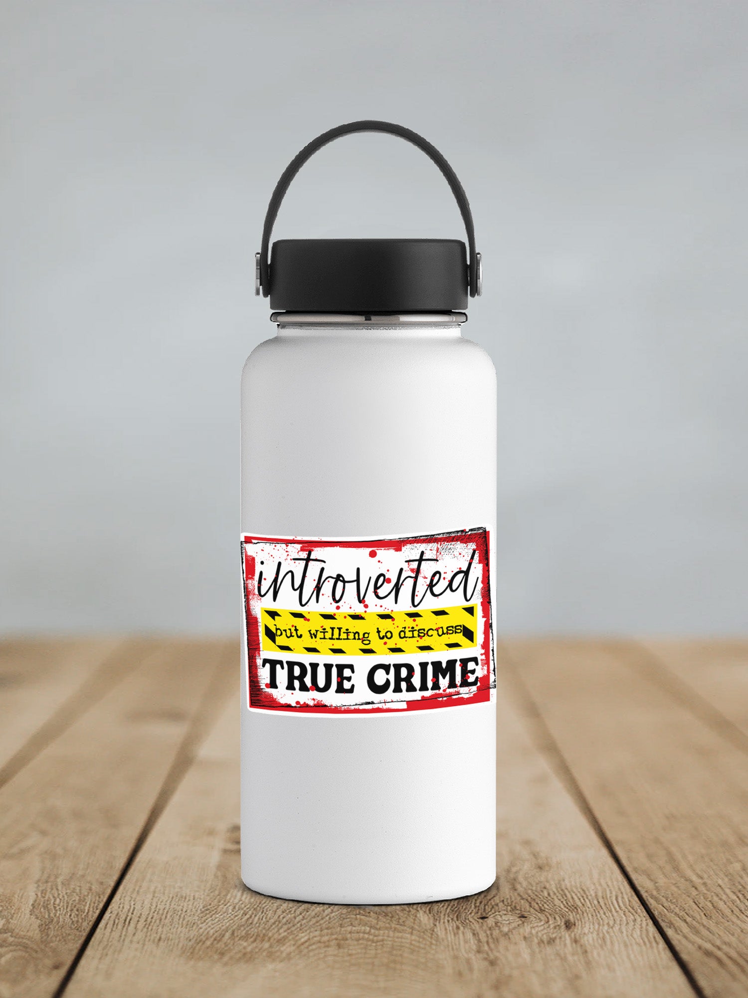 a white water bottle sitting on top of a wooden table