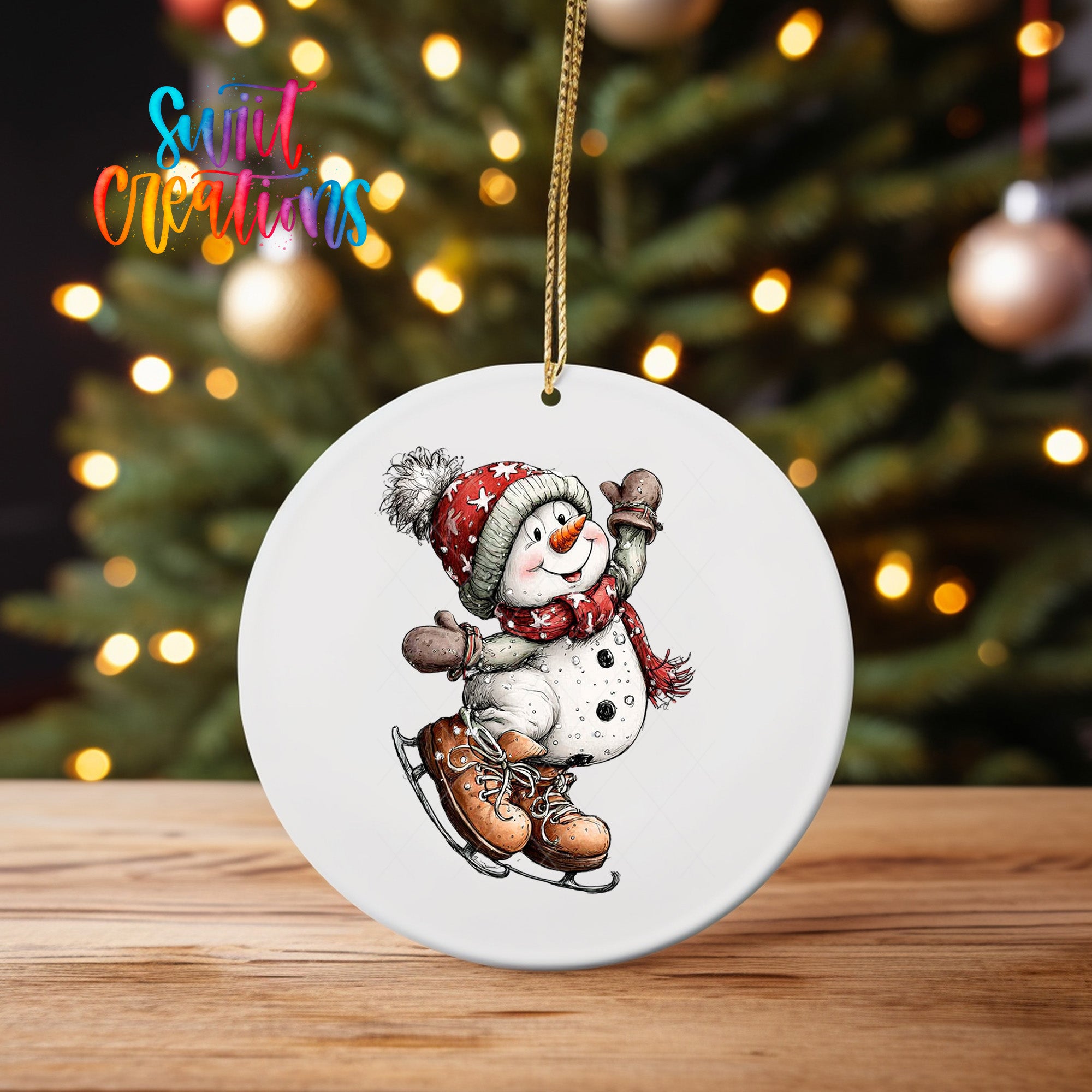 A white ornament featuring a snowman with a pair of skis, wearing a red scarf and hat, is hanging from a string.