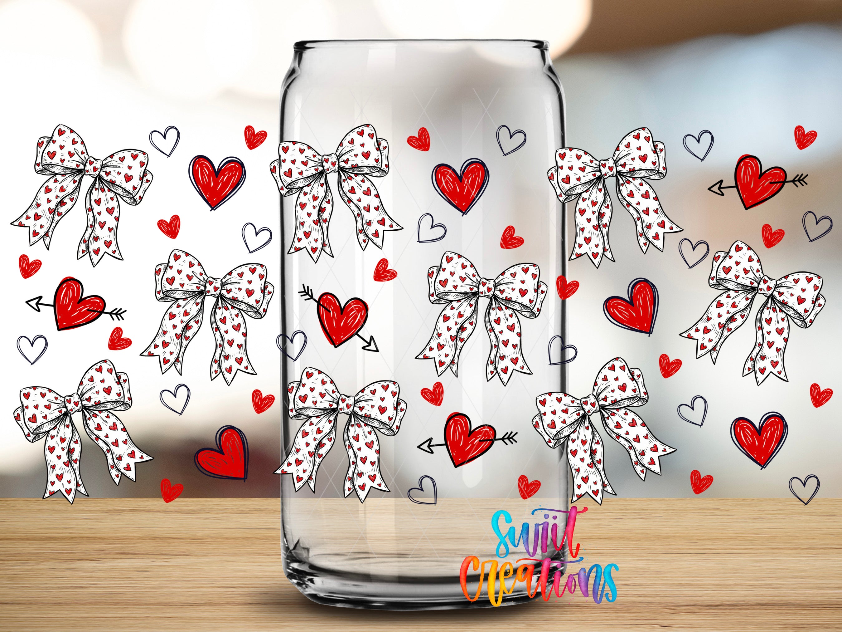 a clear glass jar with a pattern of red hearts and white polka dots, along with several red bows and hearts scattered around the jar.