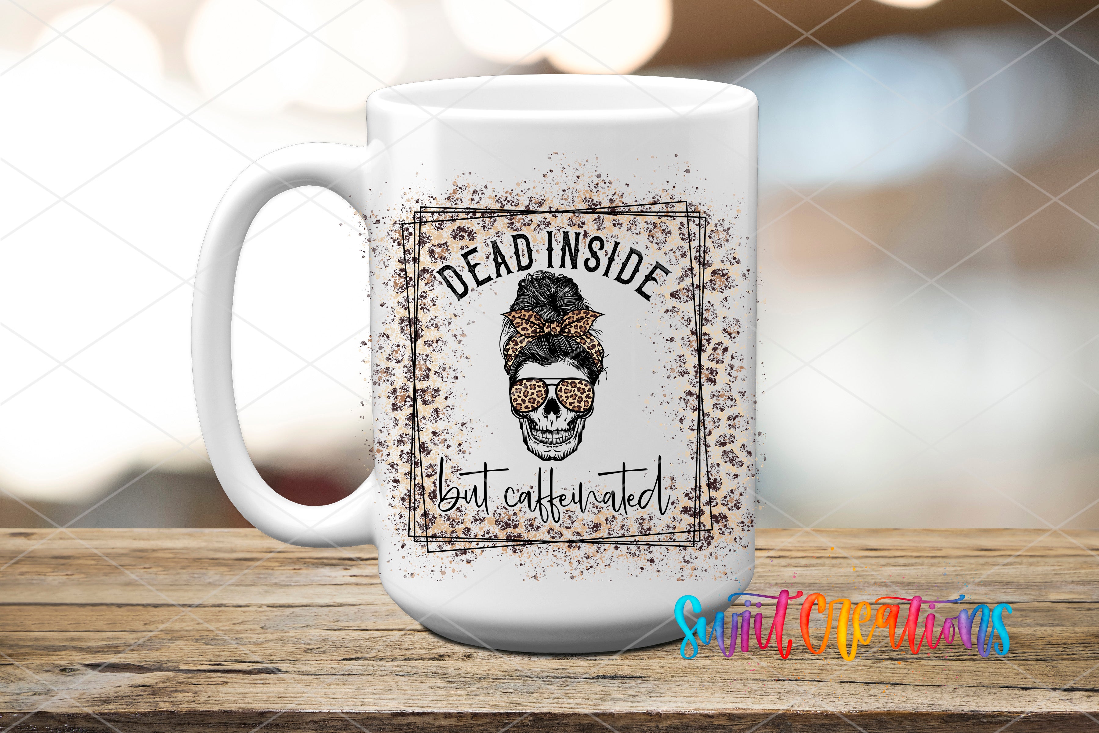 A white ceramic mug with a graphic design featuring a skull wearing sunglasses and the text "DEAD INSIDE but caffeinated" printed on it.