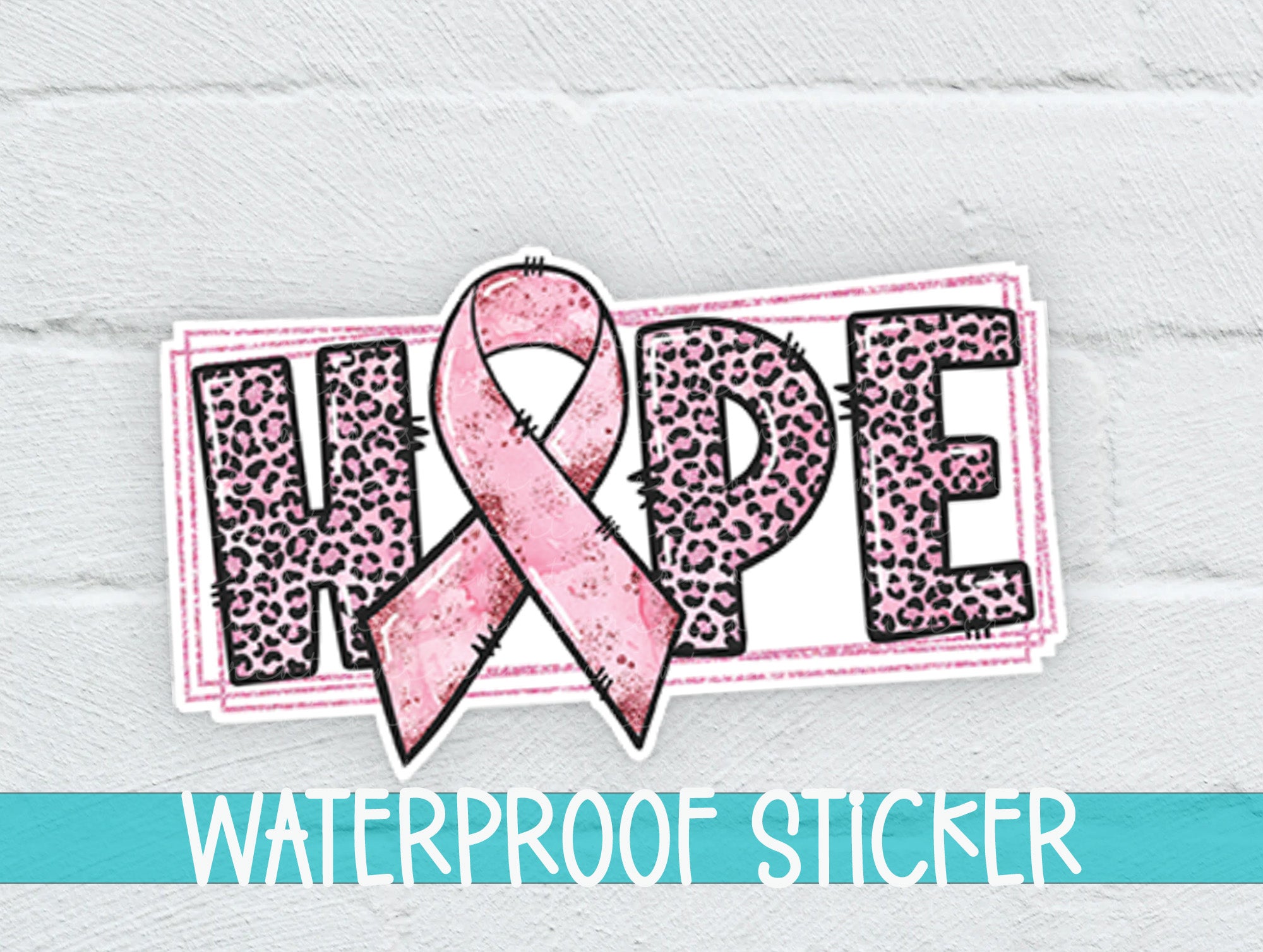 a sticker with a pink ribbon on it