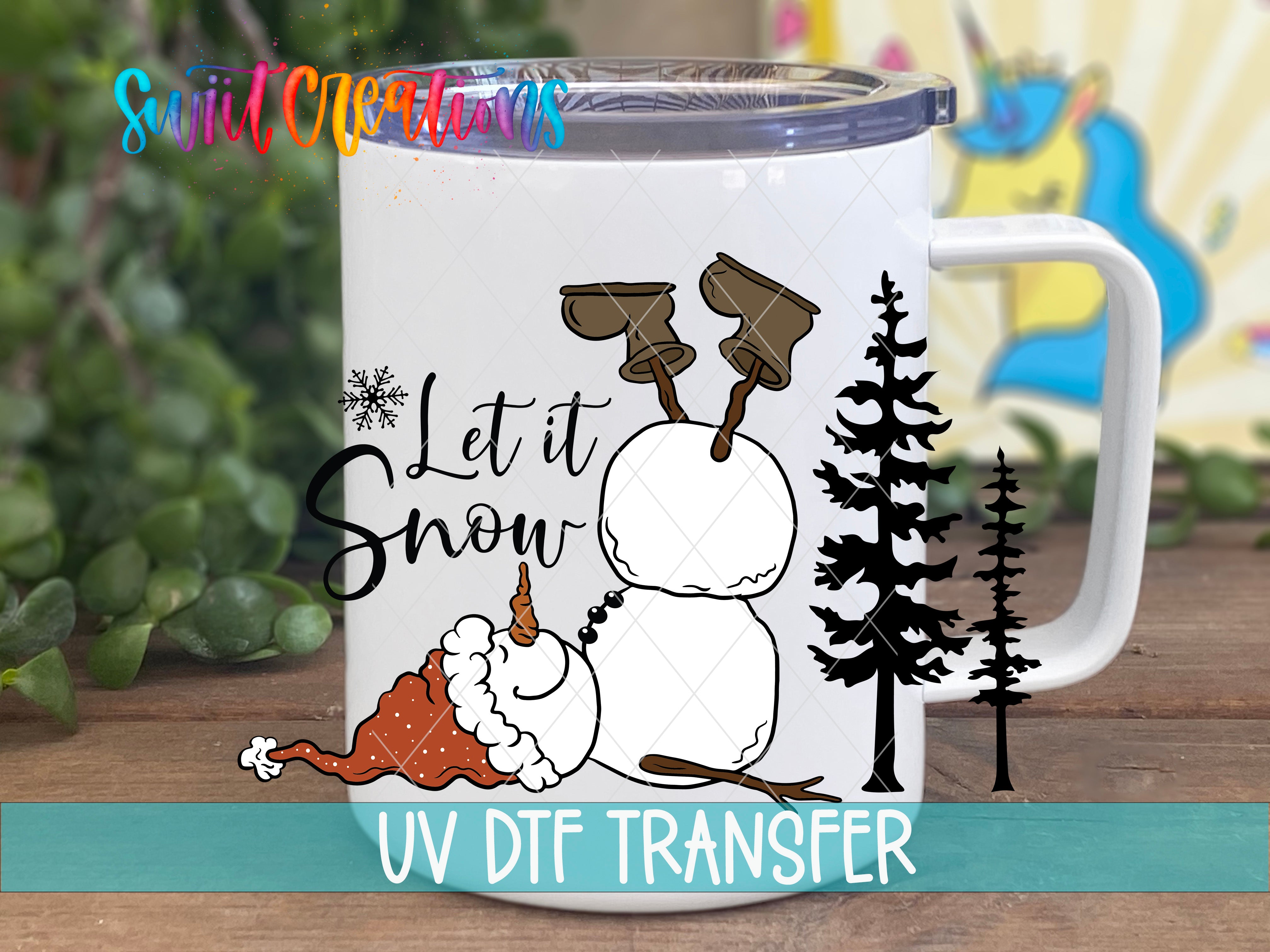 A mug with a snowman and trees on it, along with the text "Let it Snow" and "UV Dtf Transfer".