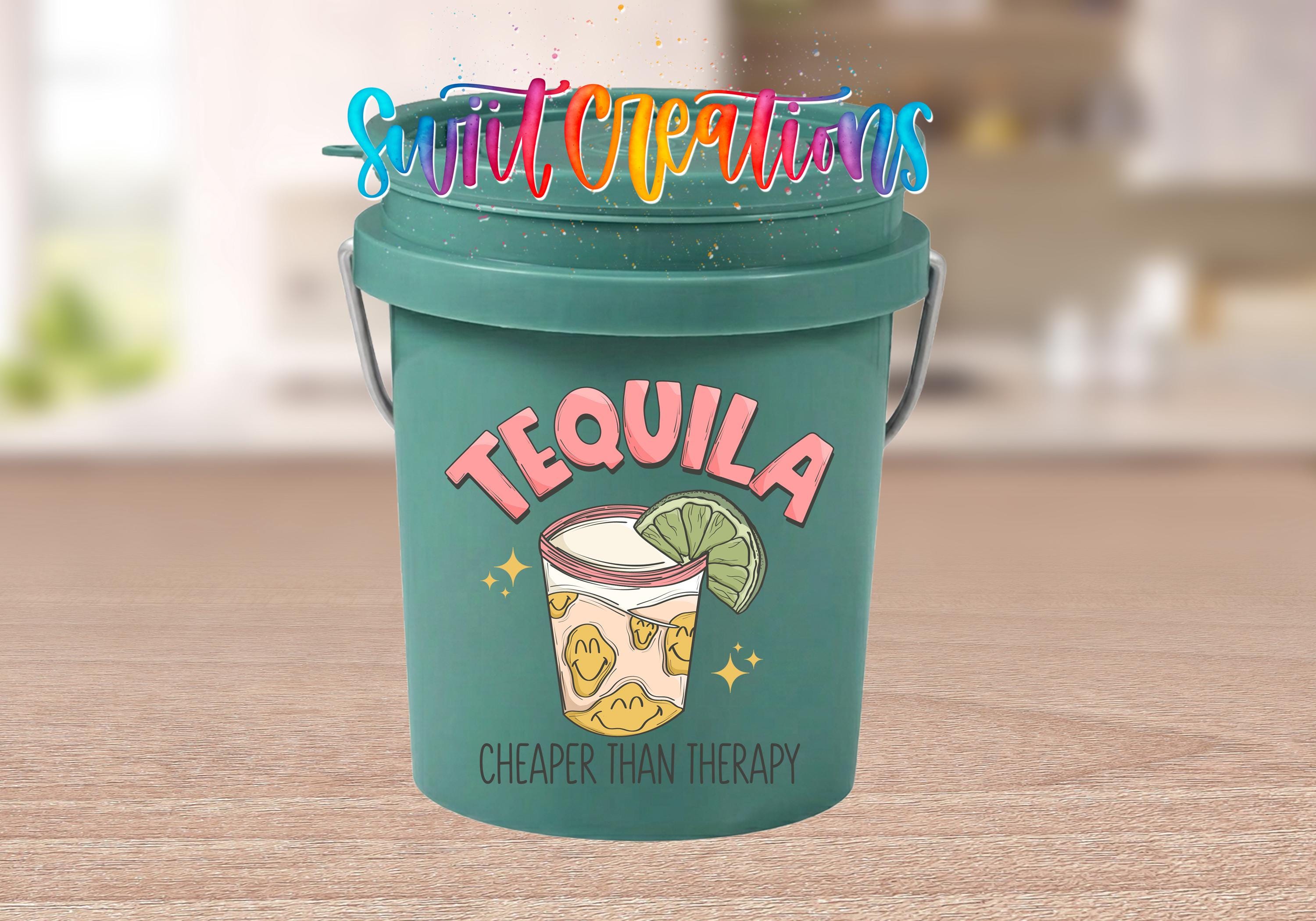 A green bucket with a tequila-themed design and text, including the words "Tequila" and "Cheaper than therapy".