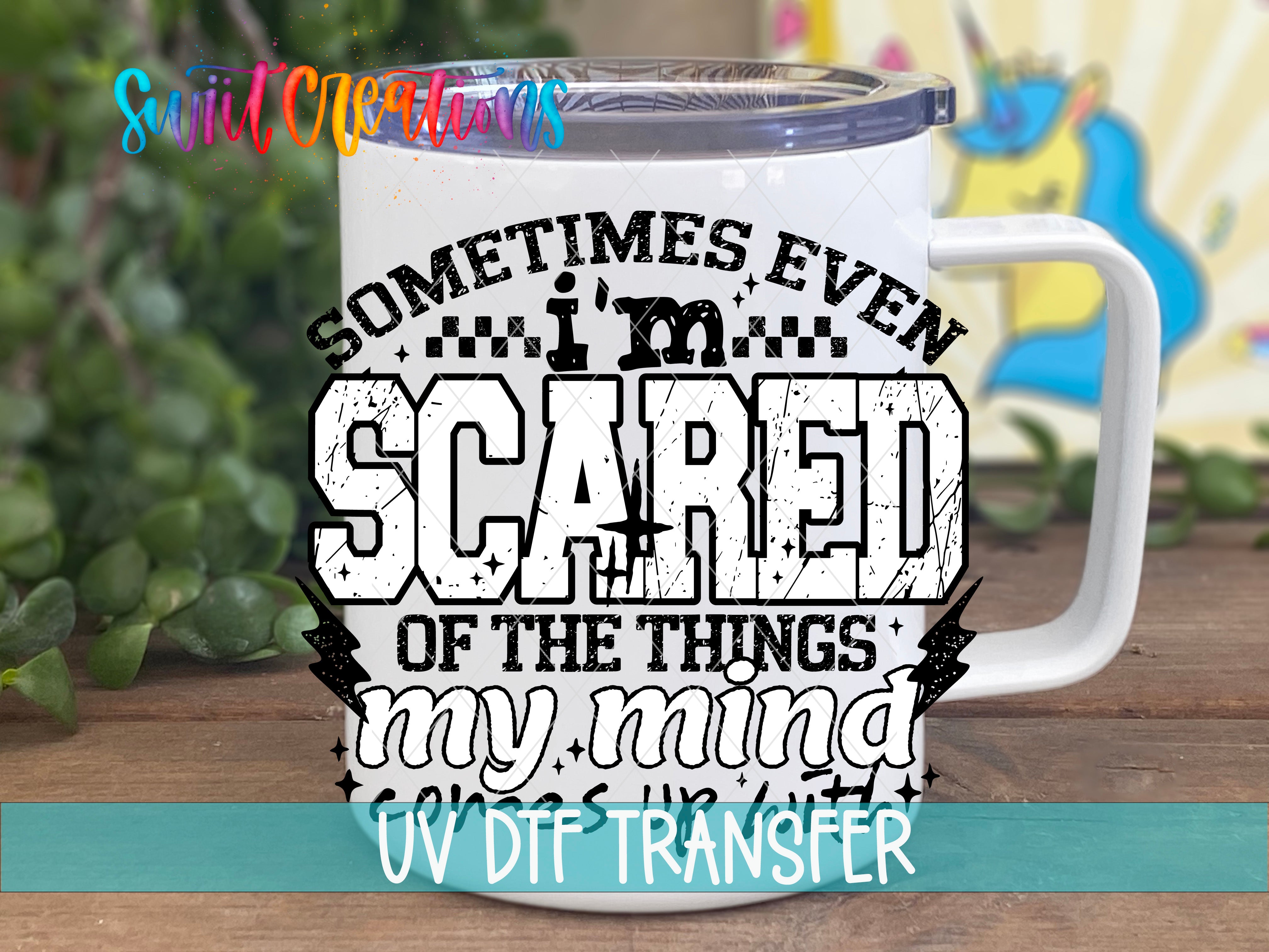 A white mug with a printed design on it, featuring the text "Sometimes even scared of the things my mind does".