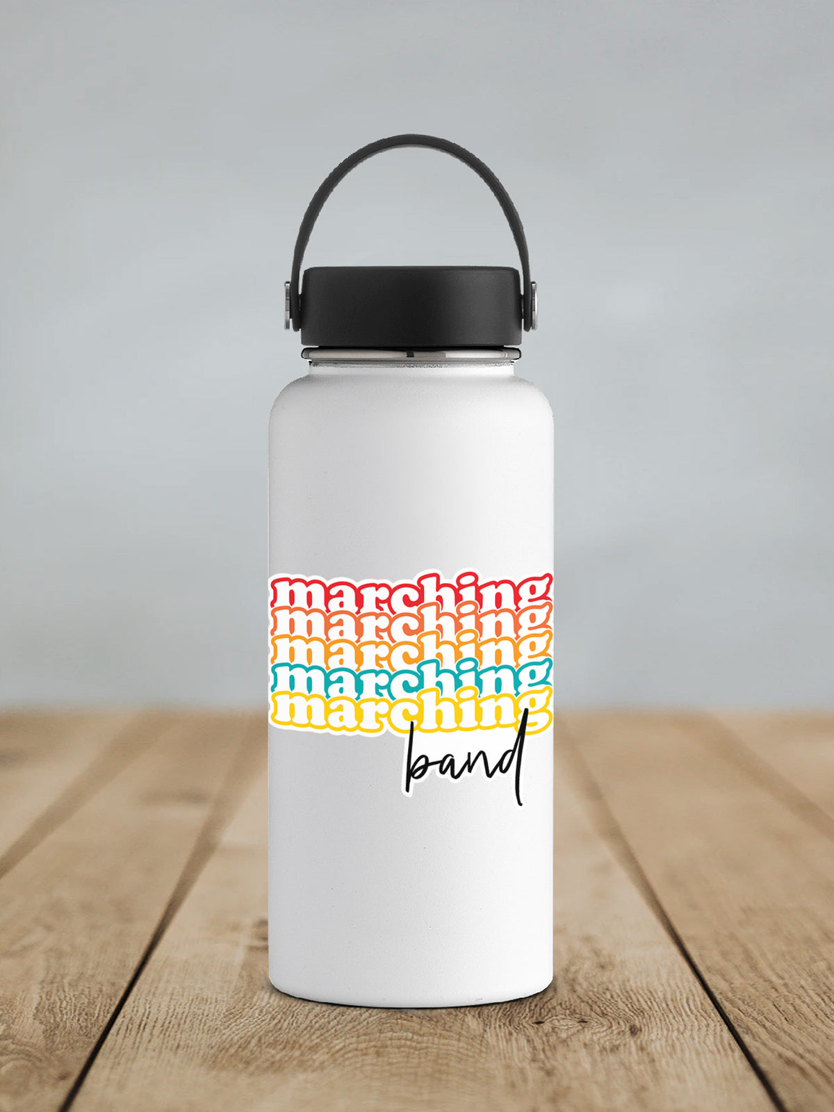 a white water bottle sitting on top of a wooden table