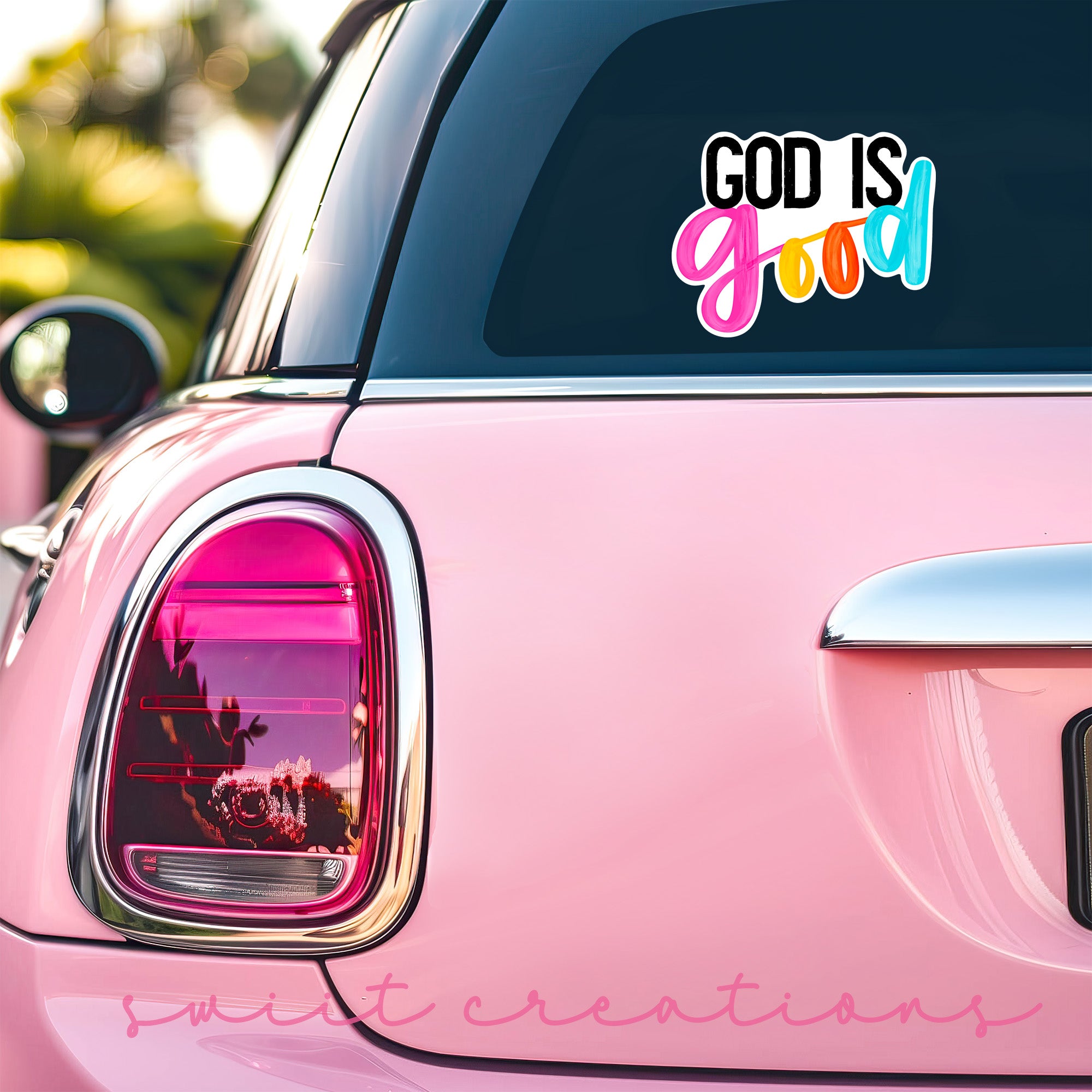 a pink car with a sticker that says god is god