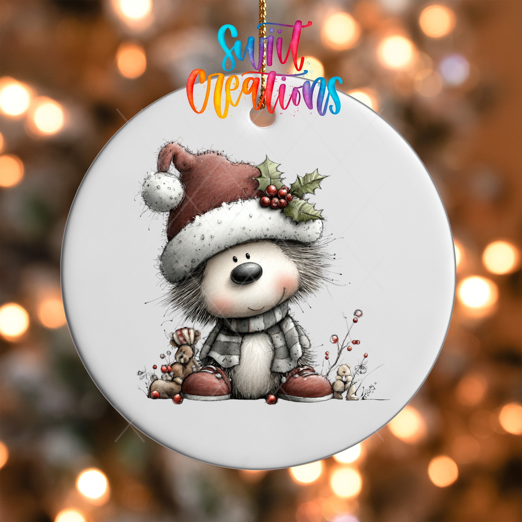 A white ornament with a cartoon illustration of a smiling hedgehog wearing a Santa hat and scarf, surrounded by holiday decorations.