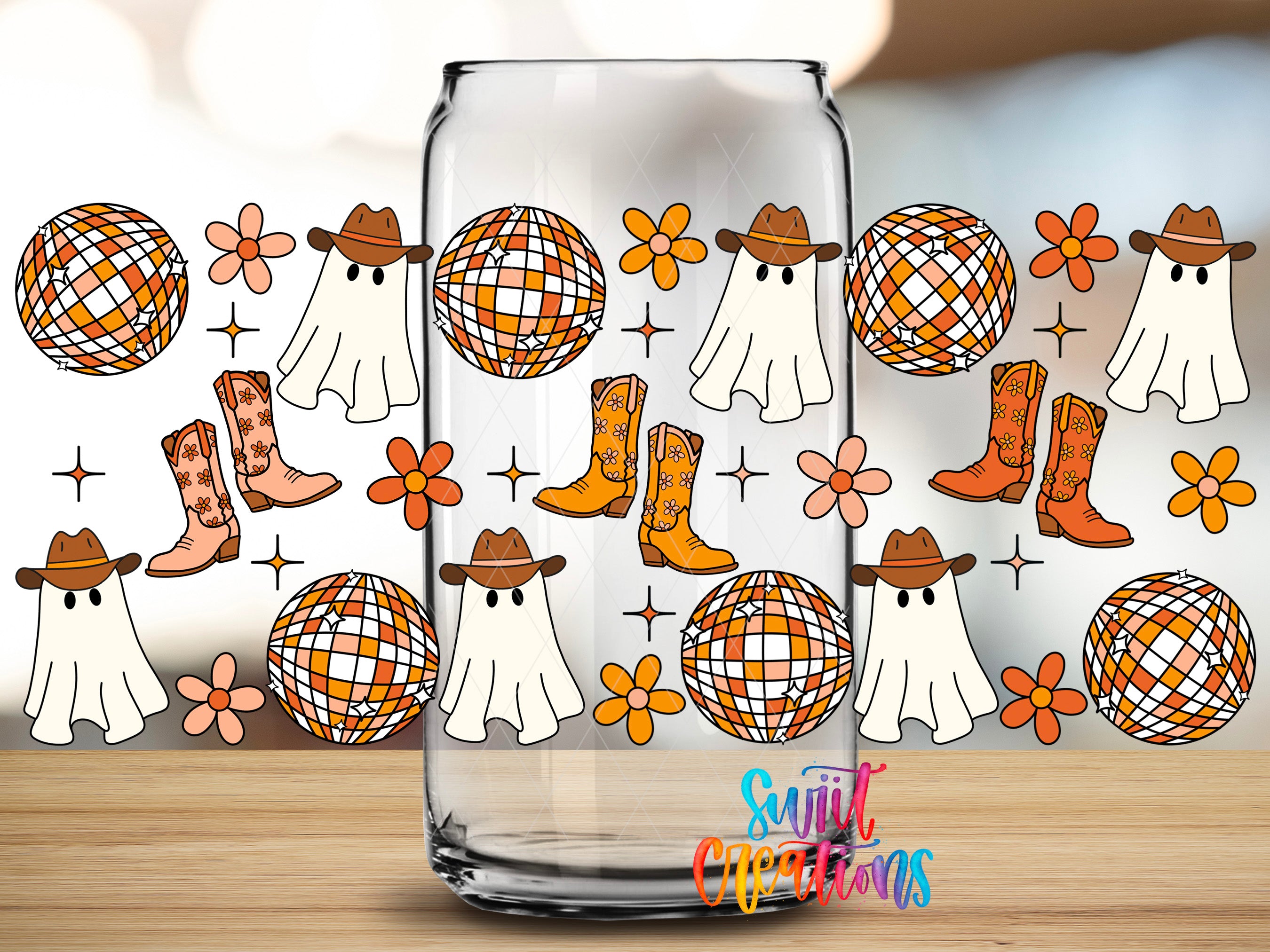 a glass can with a pattern of ghost, disco balls, cowboy boots, and flowers on it.