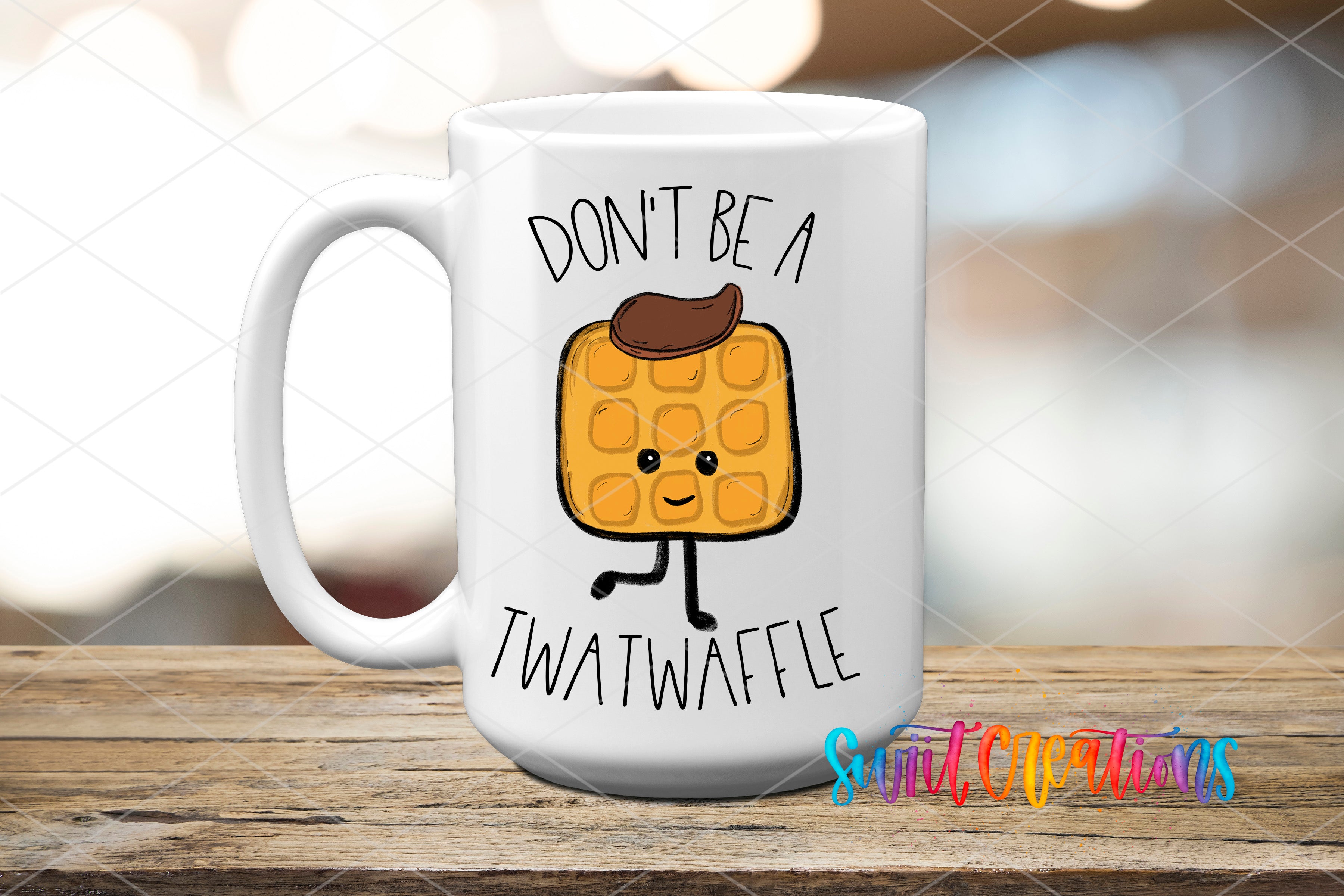 A white ceramic mug with a cartoon image of a waffle and the text "DON'T BE A TWATWAFLE" printed on it.