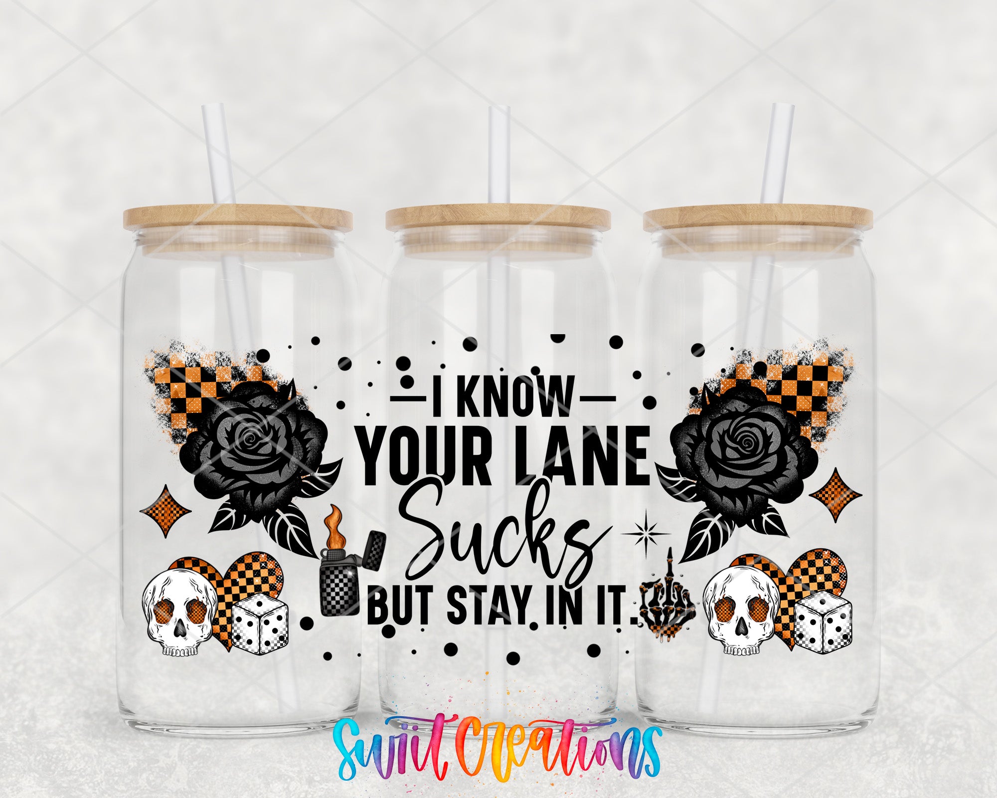 three glass tumblers with black and orange designs, including skulls, roses, and dice. The text on the tumblers reads "I know your lane sucks but stay in it!"