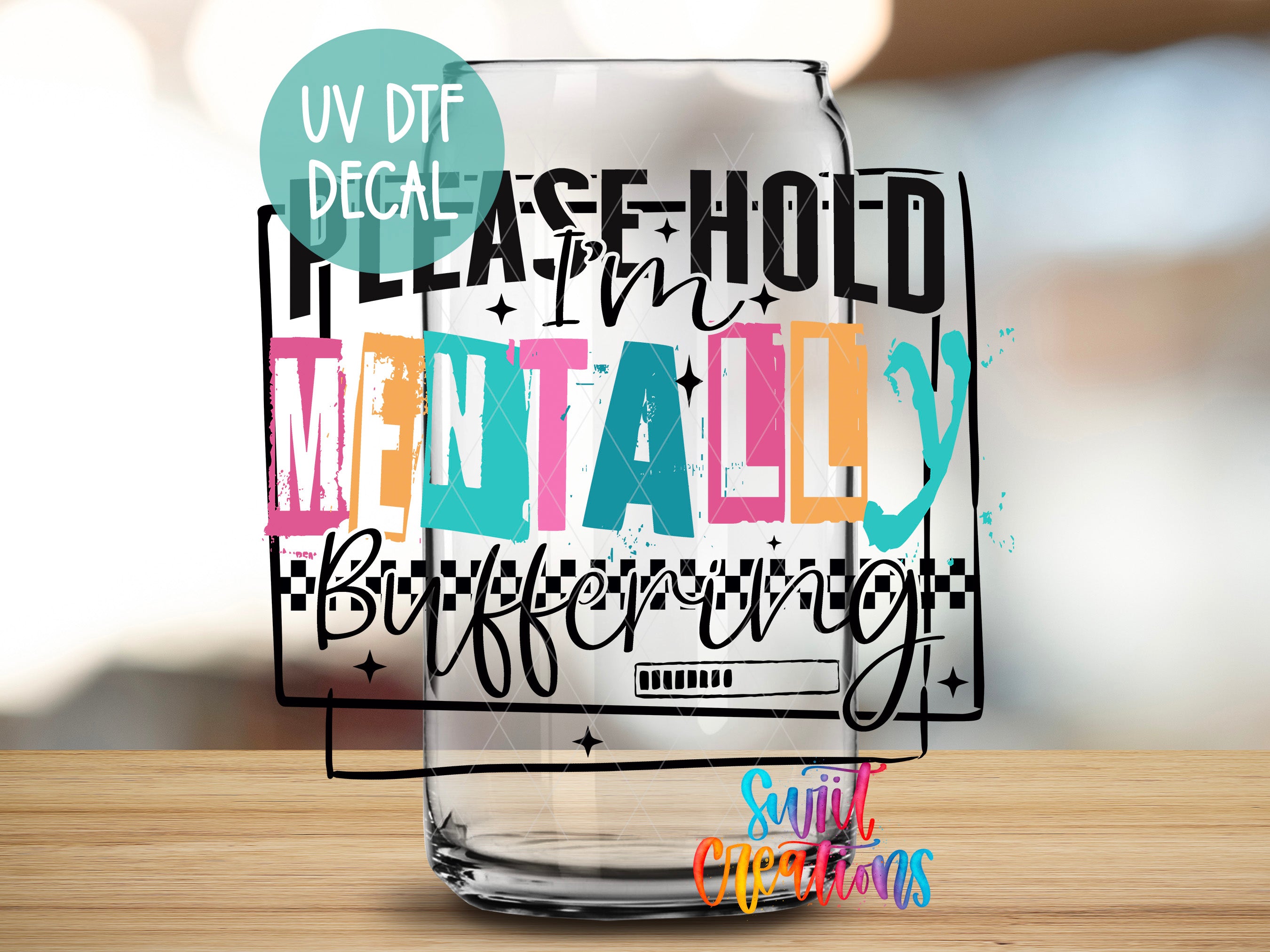 a colorful and stylized text that reads "Please hold mentally" on a transparent glass surface.