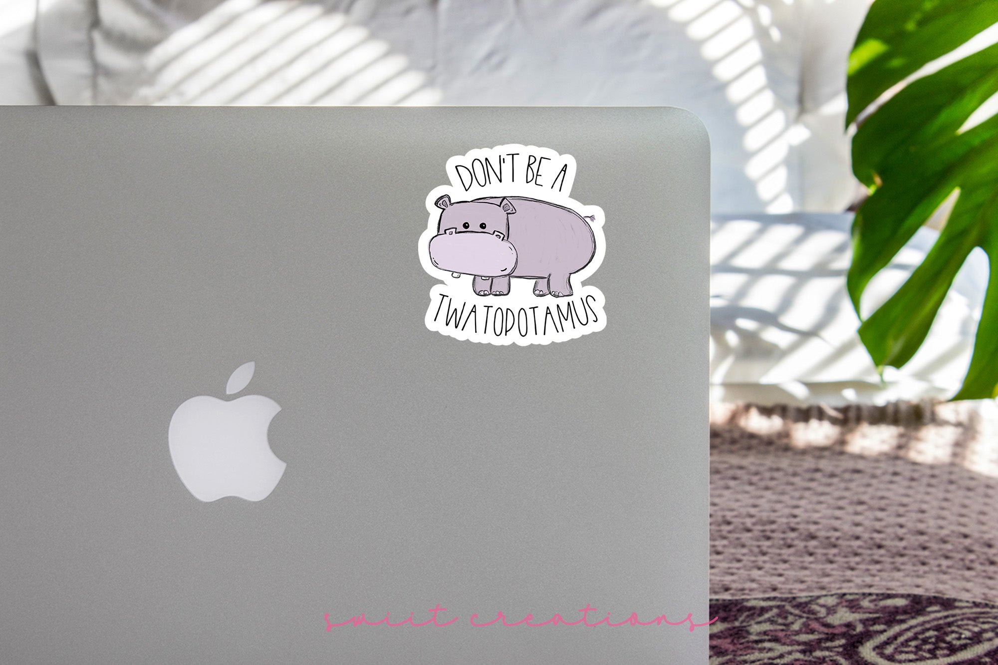 a laptop with a sticker on it sitting on a table