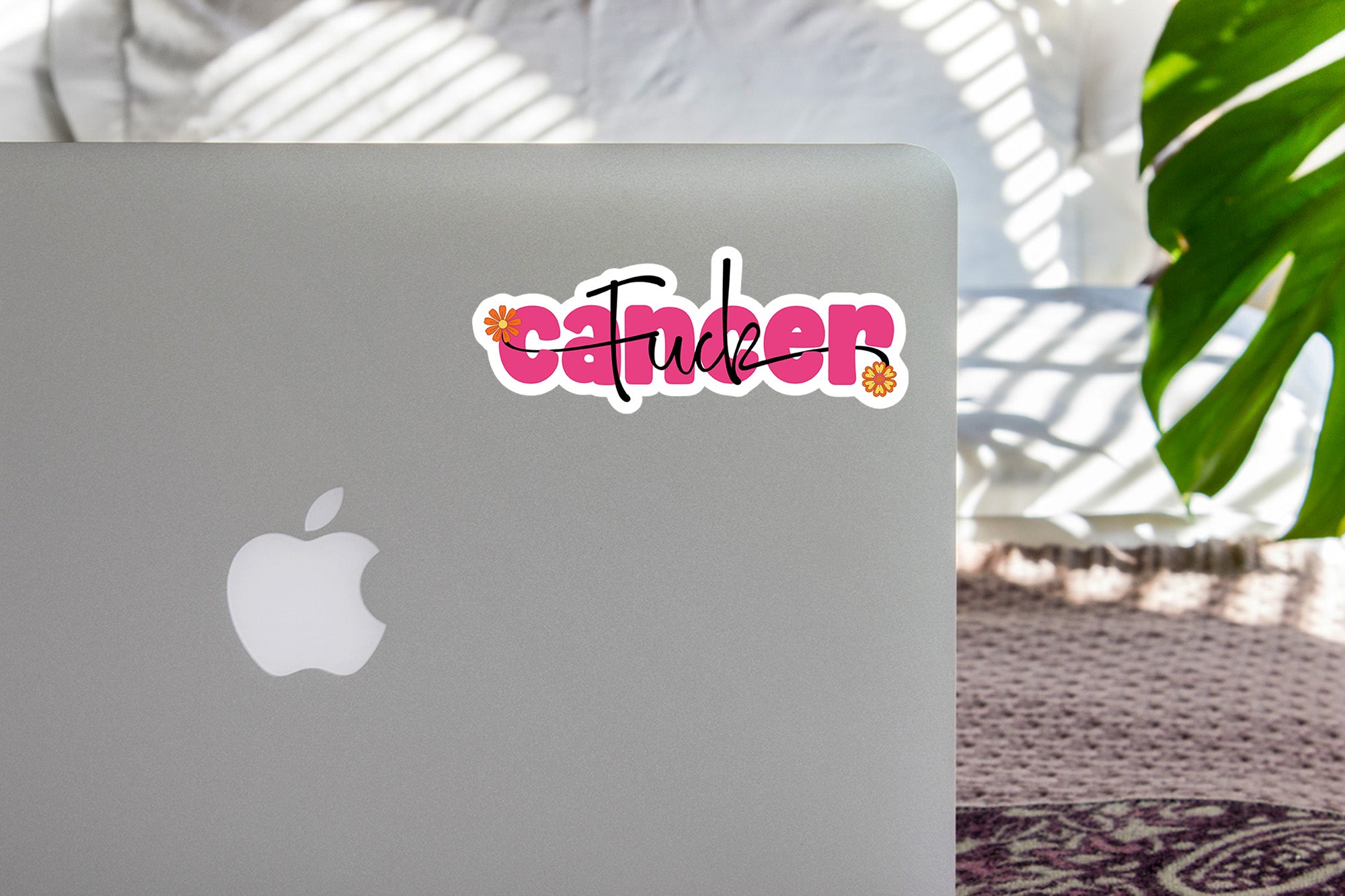 a laptop computer sitting on top of a table