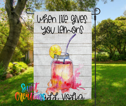 A banner with a lemon-based drink in a mason jar, accompanied by the text "When life gives you lemons" and "Vodka".