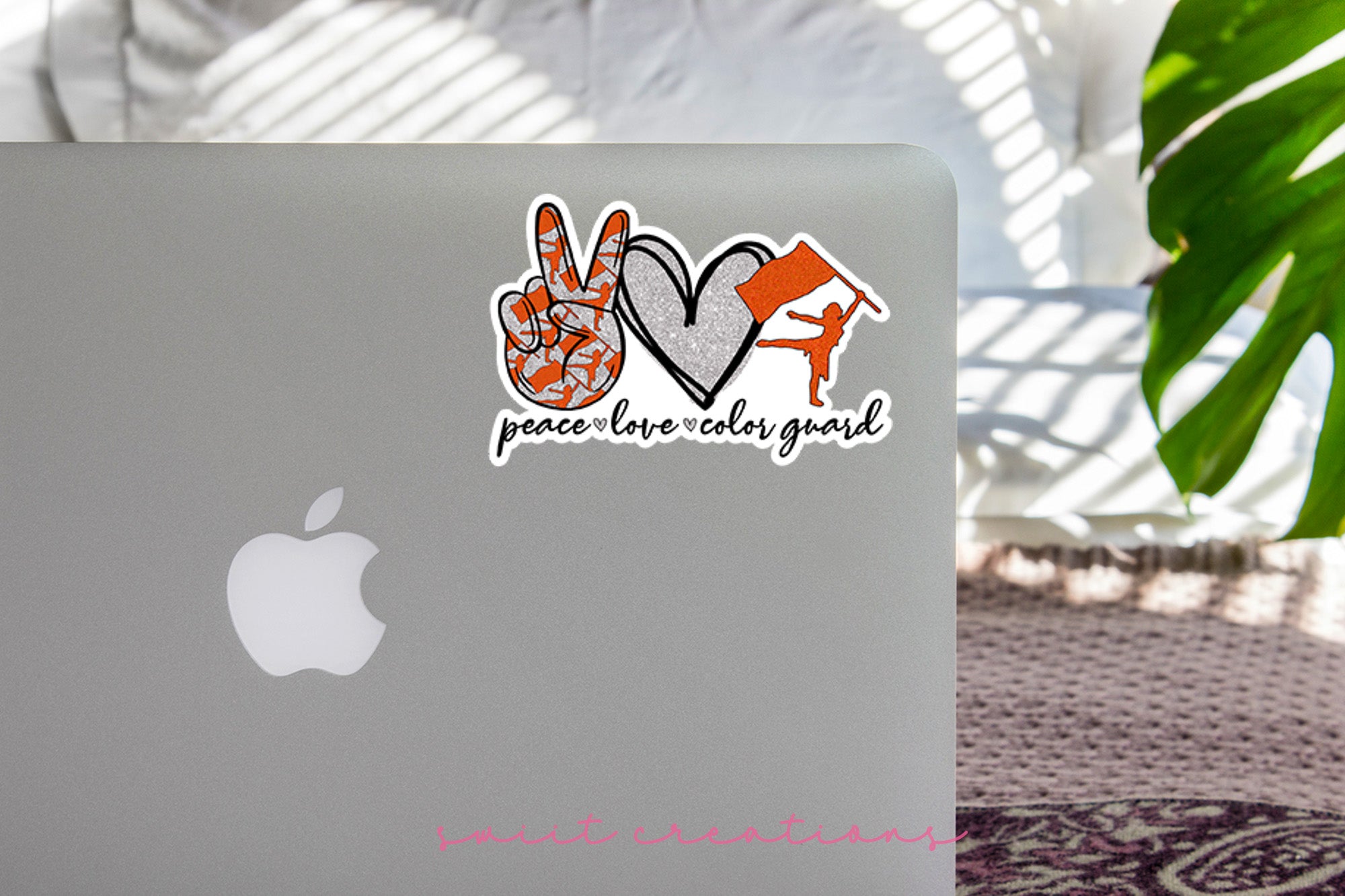 a laptop computer sitting on top of a table