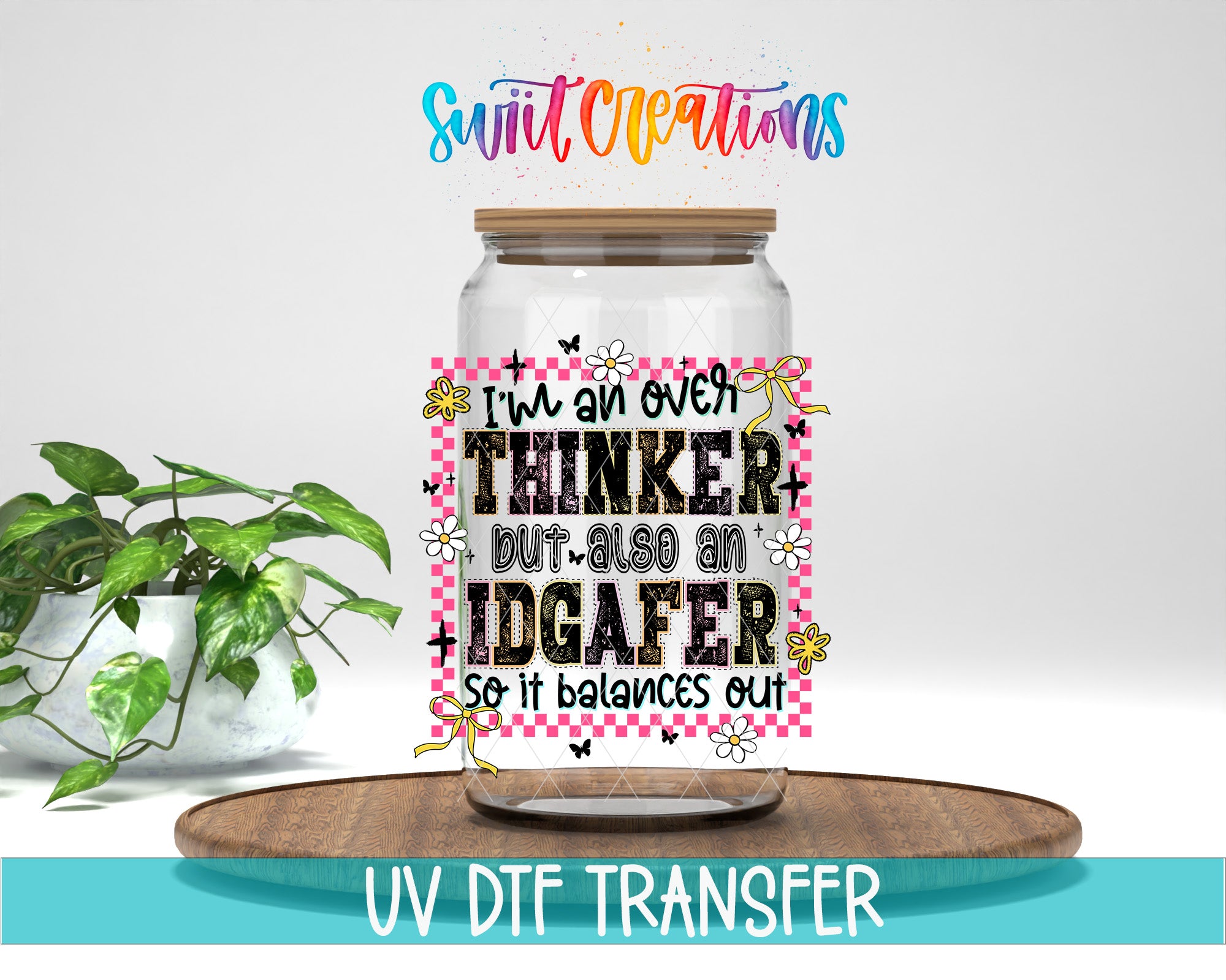 a glass jar with a label that says "I'm an over-thinker but also an idgaferer. So it balances out" and includes a checkered pattern. The jar is placed on a wooden tray, and there is a potted plant in the background.