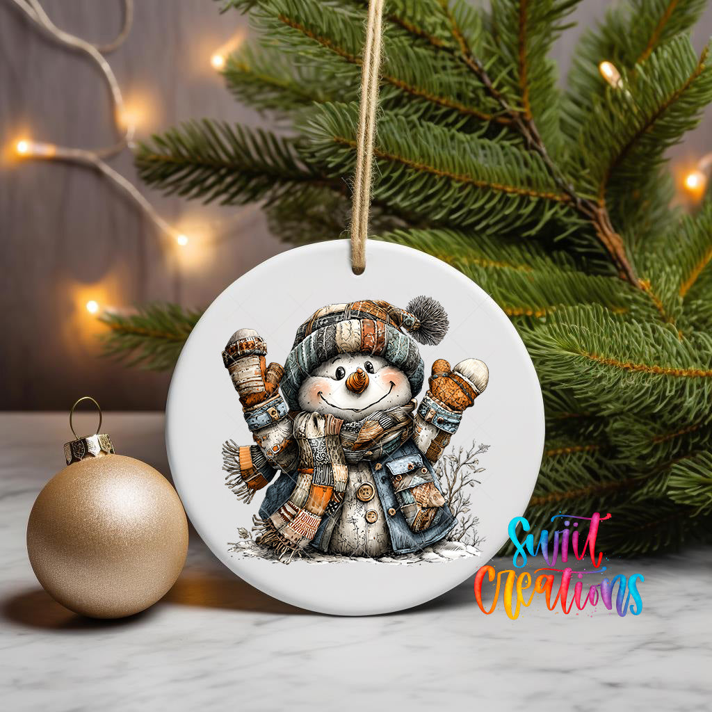 A white ceramic ornament featuring a cheerful snowman is displayed on a table, with a Christmas tree and twinkling lights in the background.