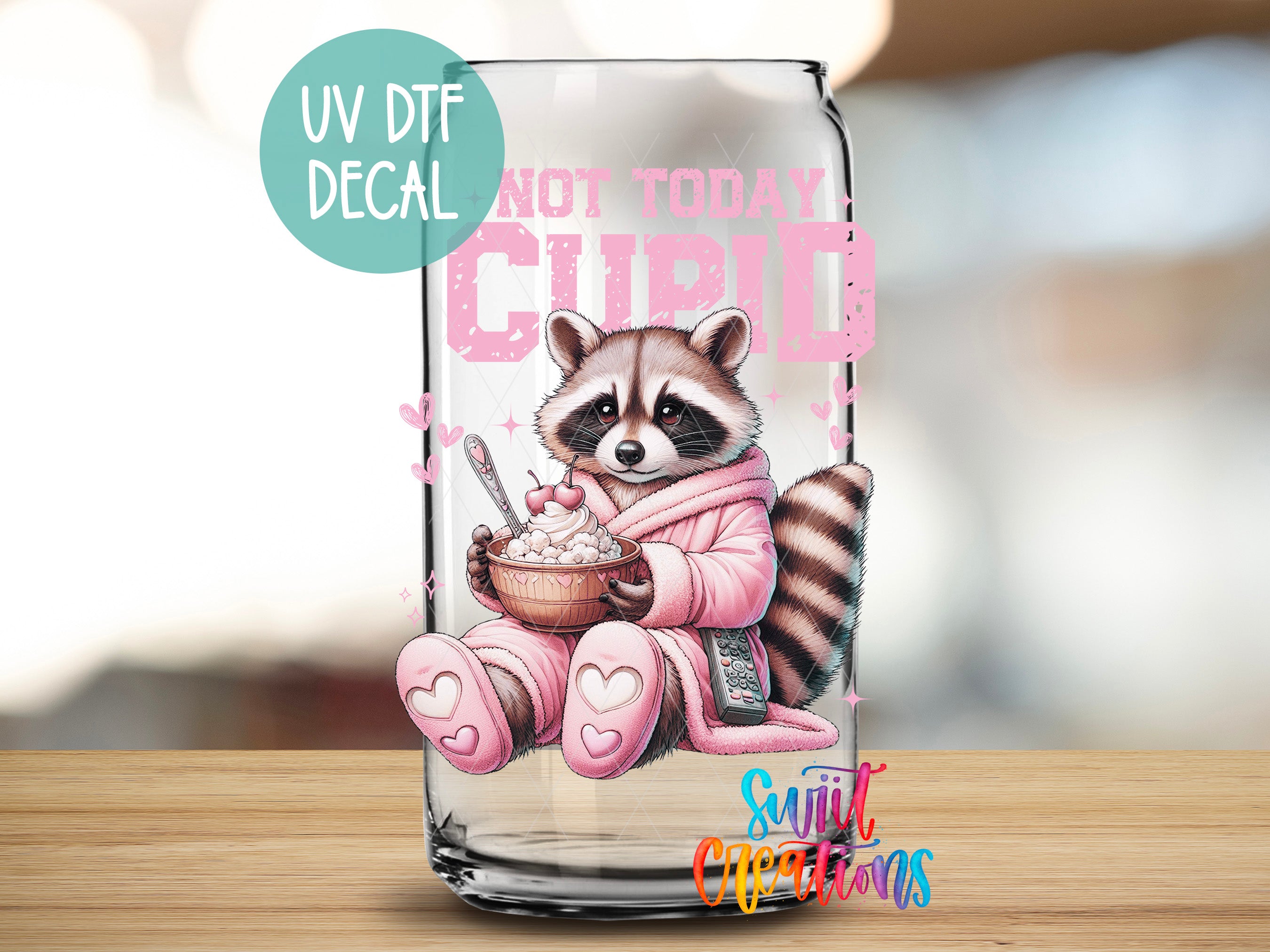 A glass can with a raccoon wearing a pink robe and holding a bowl of food, with the text "Not today cupid" written on it.