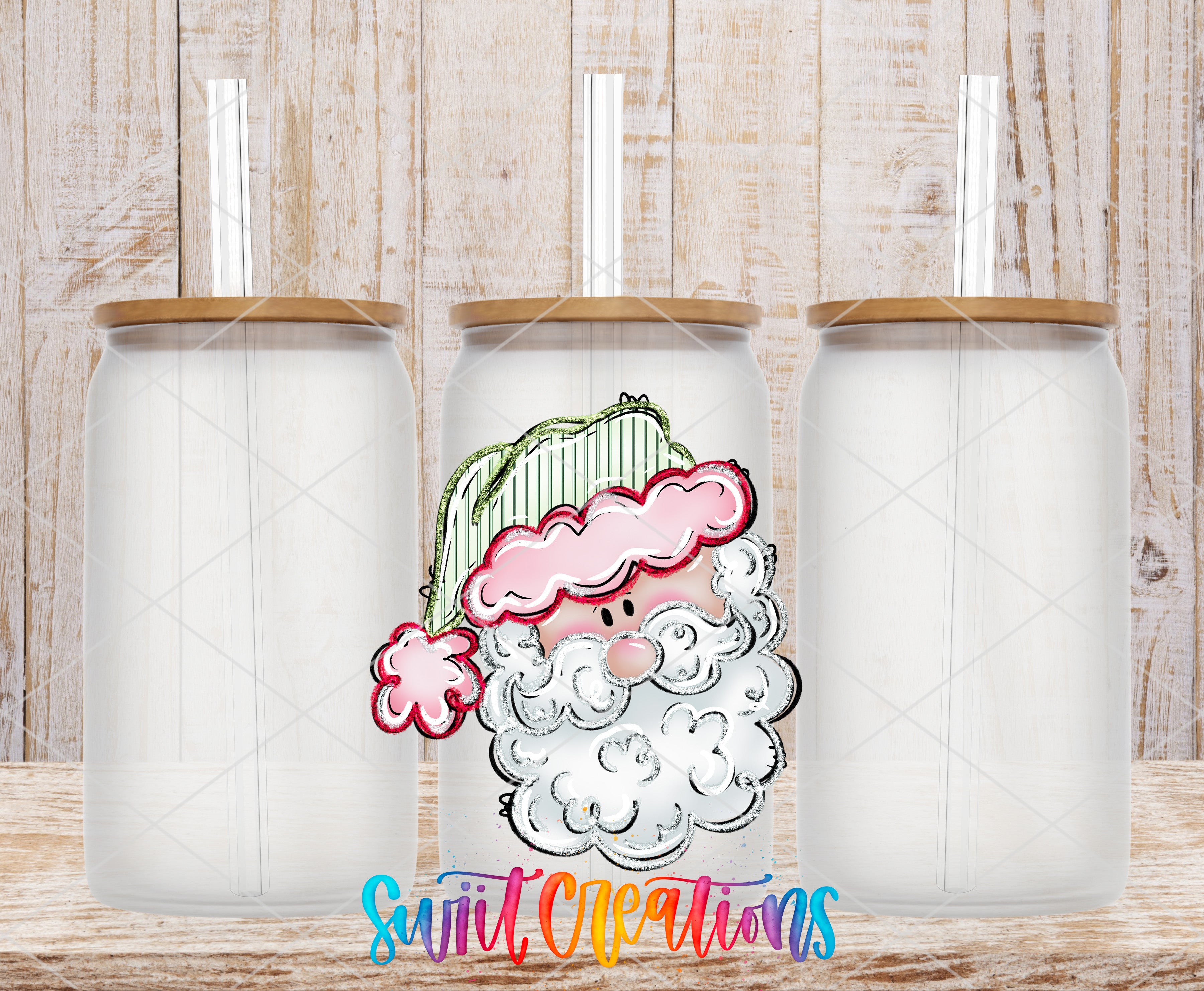 three clear glass jars with brown lids, each with a straw sticking out of the top. The jars are arranged in a row, and there is a colorful illustration of a smiling Santa Claus on one of the jars.