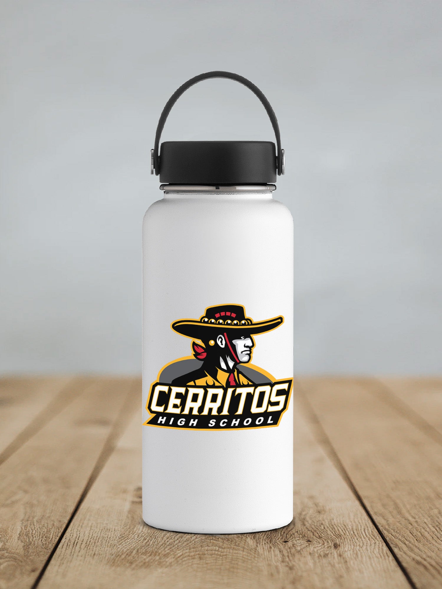 a white water bottle sitting on top of a wooden table