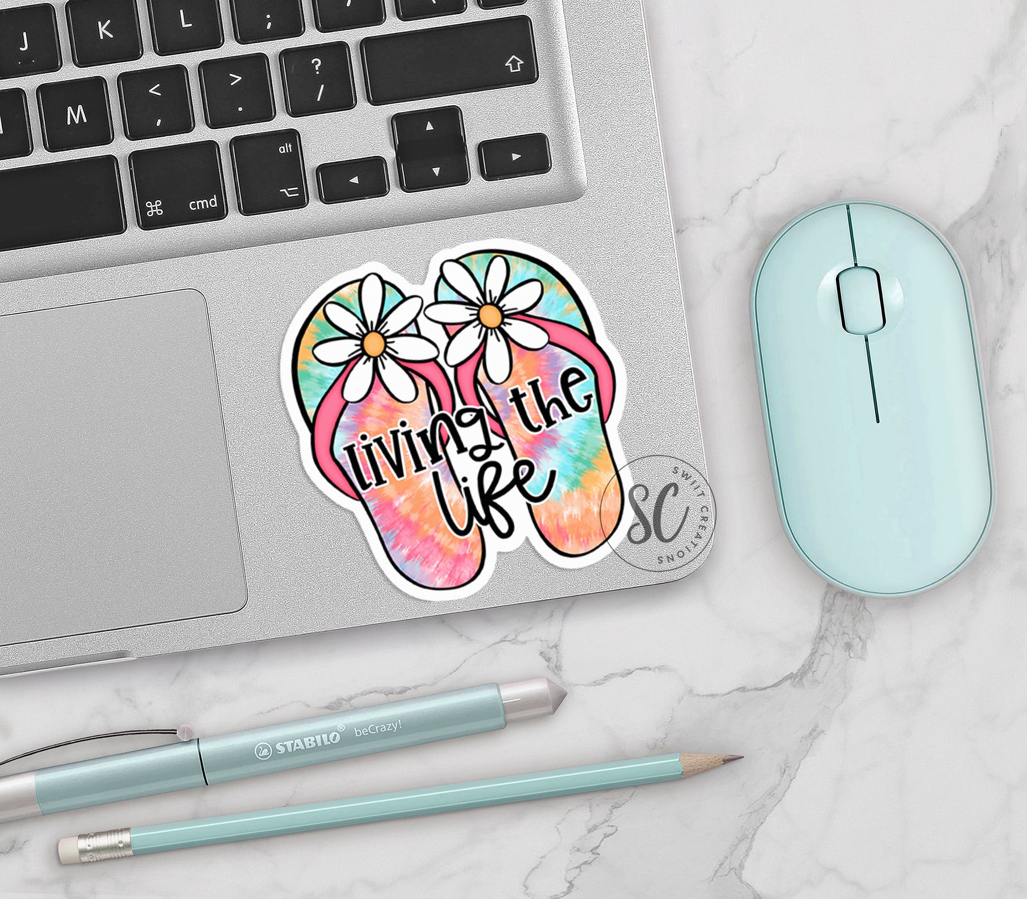 a laptop with a sticker of a pair of flip flops