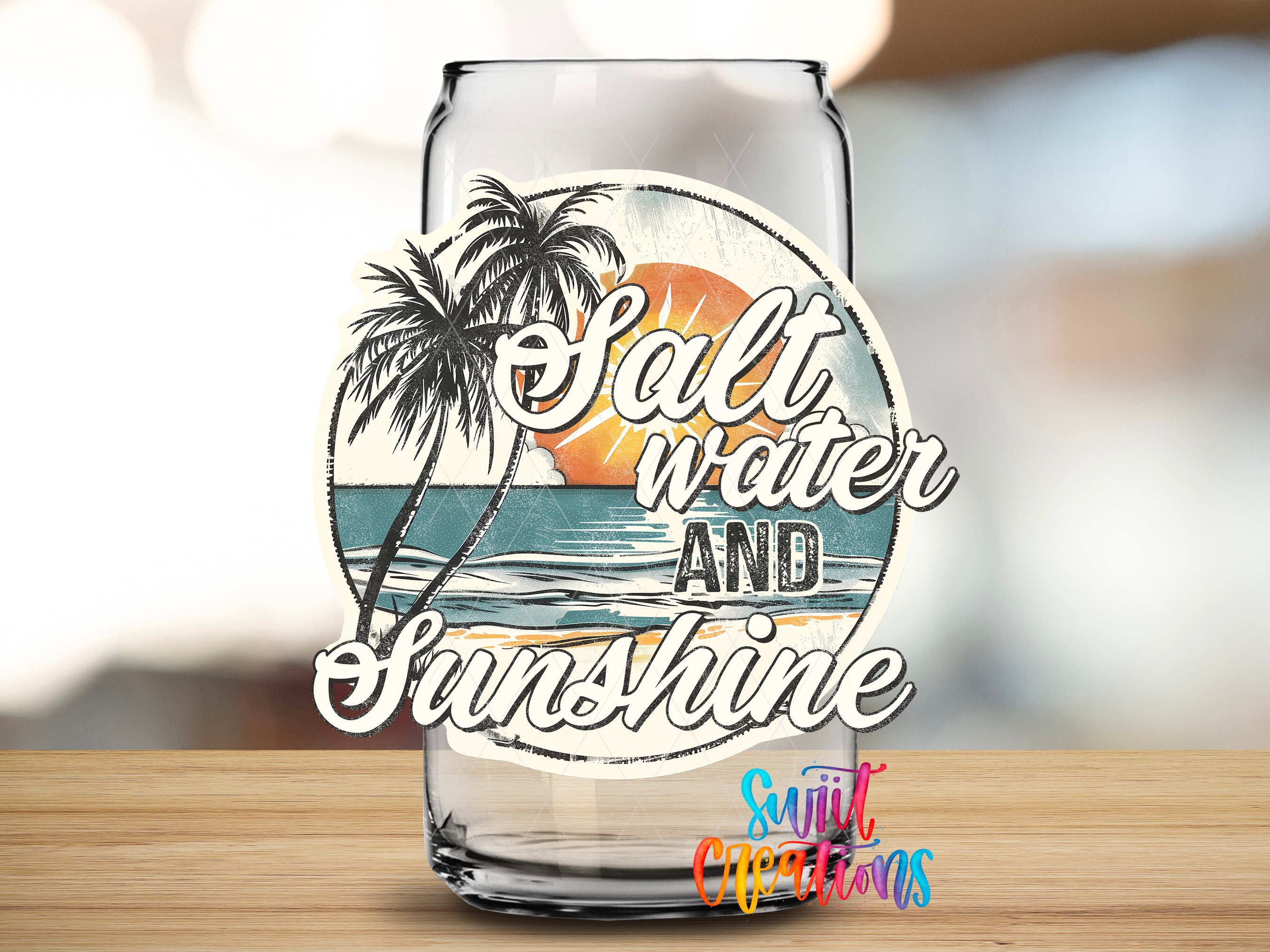 A glass can with a label that says "Salt Water and Sunshine" and features a beach scene with palm trees and a sunset.