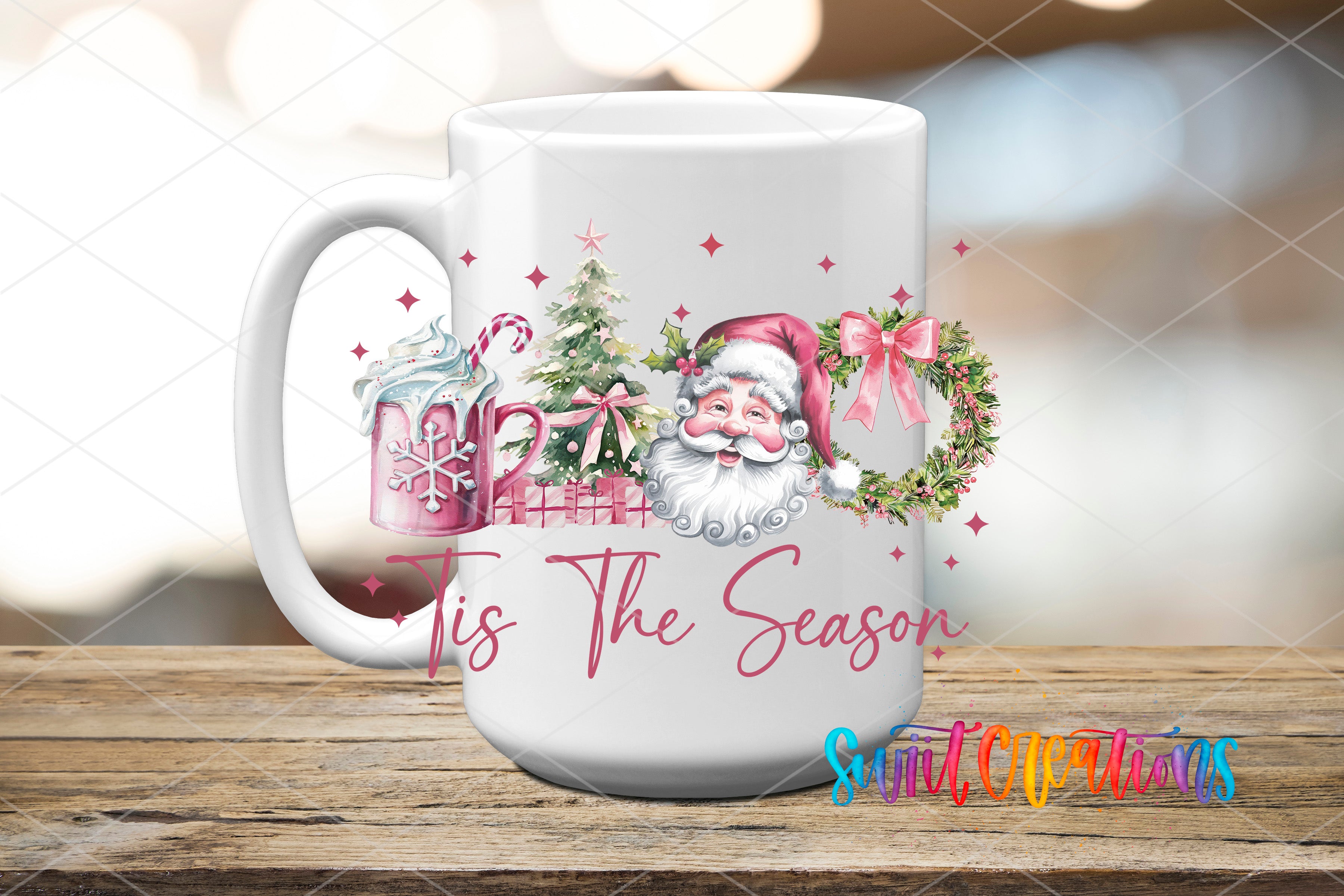 A white mug with a festive design featuring Santa Claus, Christmas trees, and snowflakes, along with the text "Tis the Season" and "Small Christmas".