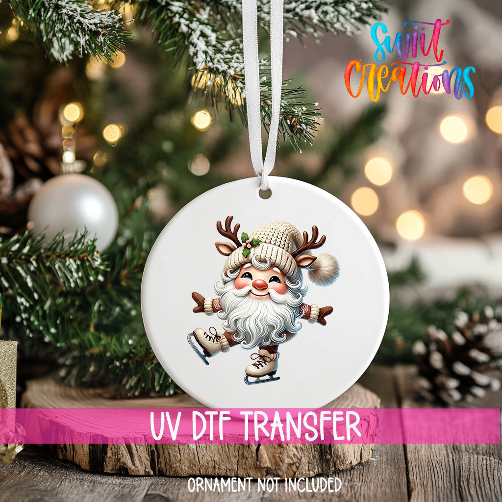 A white ornament with a Santa Claus image is hanging on a Christmas tree, with a blurred background of pine branches and twinkling lights.