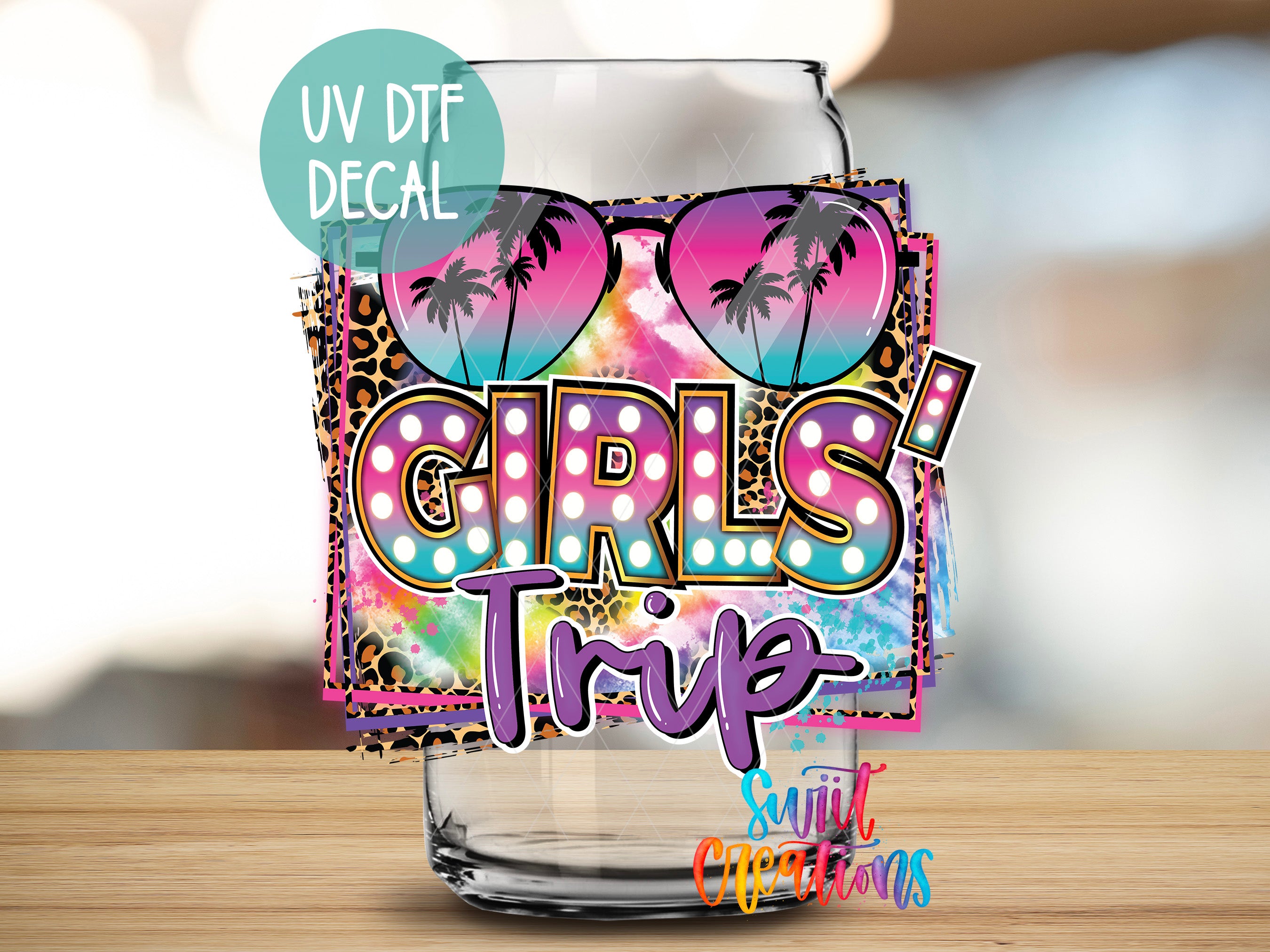 a glass with the words girls trip written on it