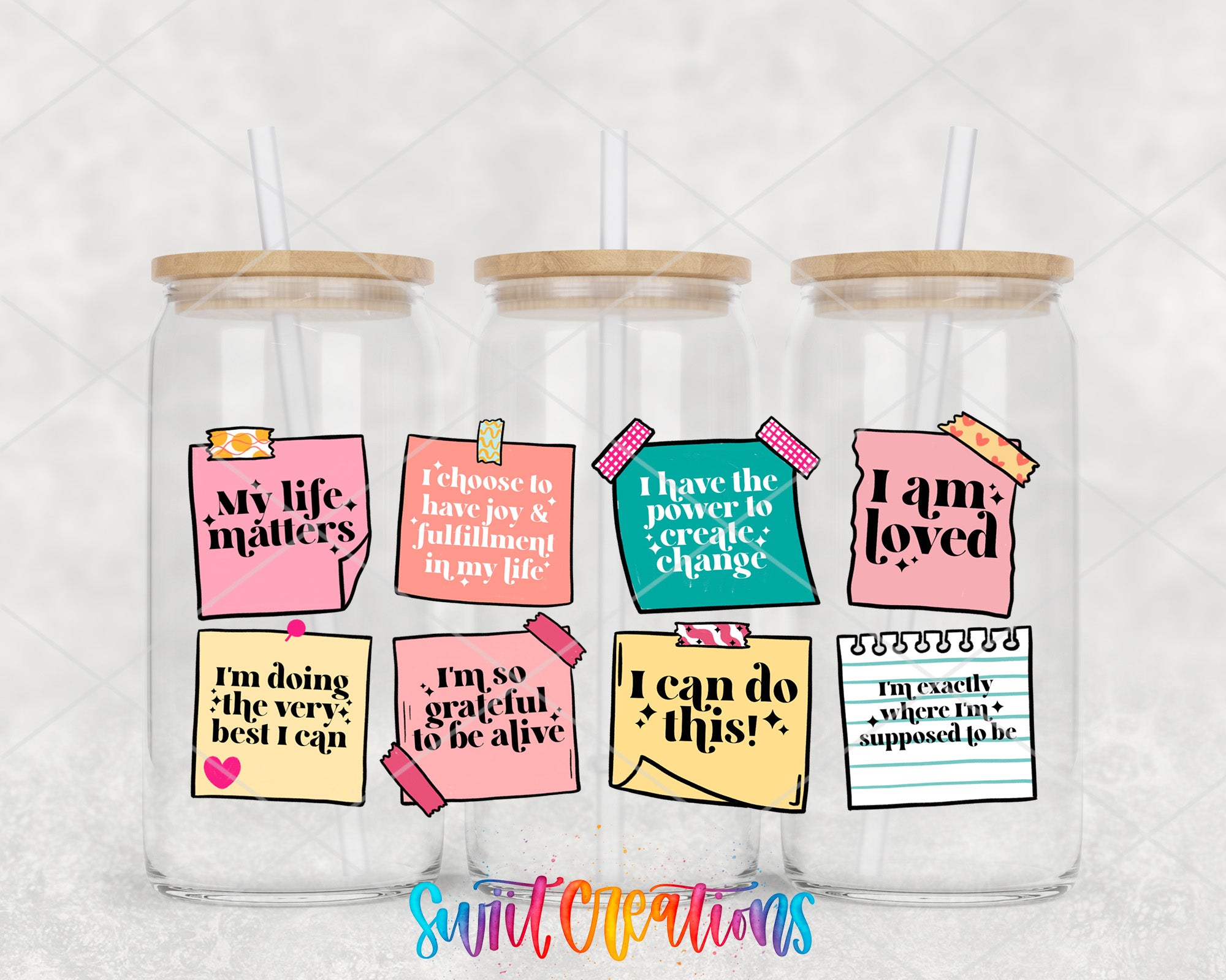 three glass jars with colorful stickers and straws, each containing a motivational quote or message.