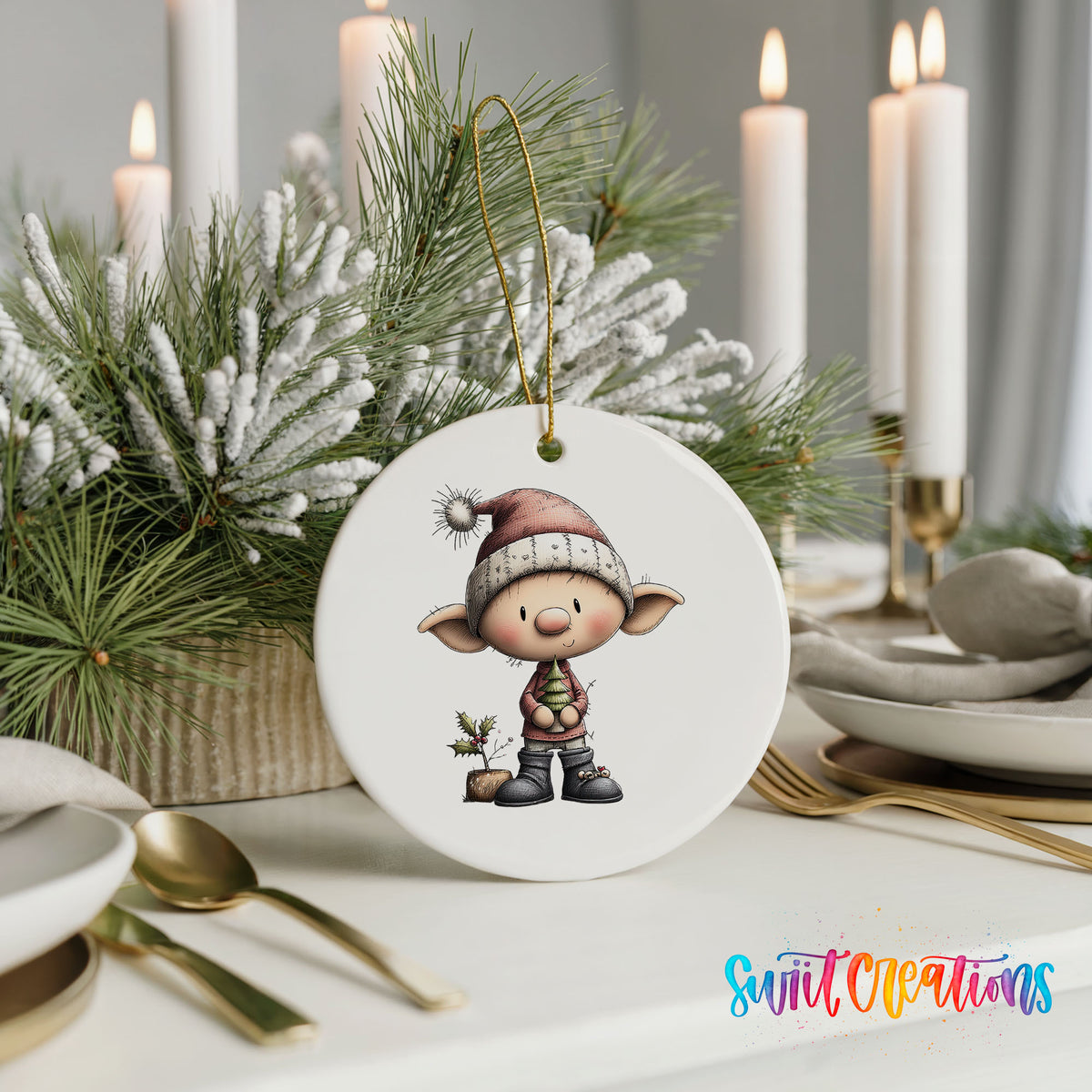 A white ornament featuring a cartoon elf wearing a Santa hat and holding a holly leaf, placed on a table with candles and a floral arrangement.