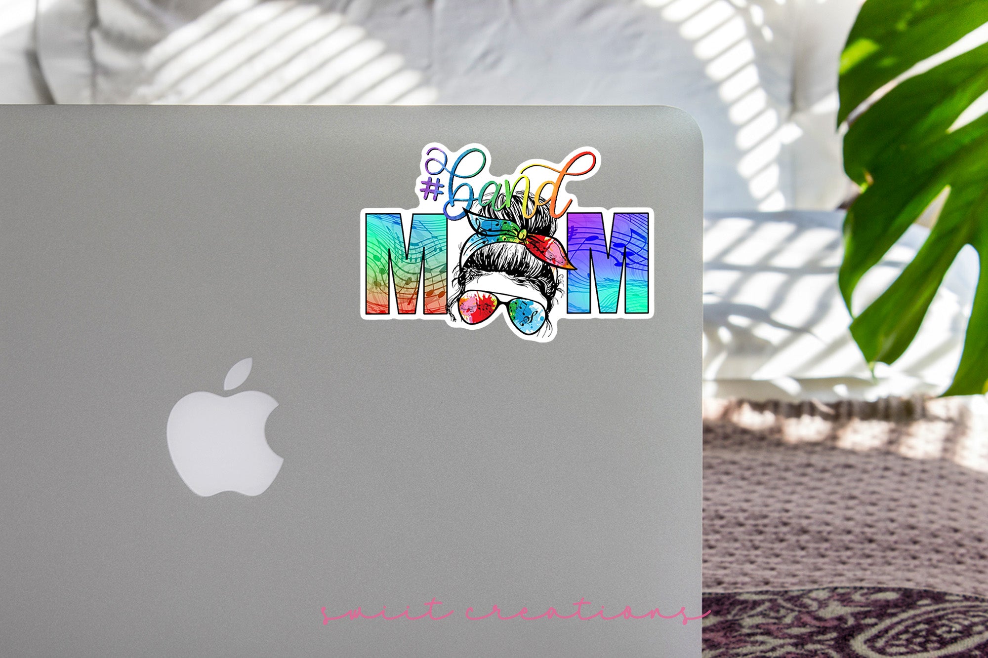 a laptop with a sticker of a woman's face