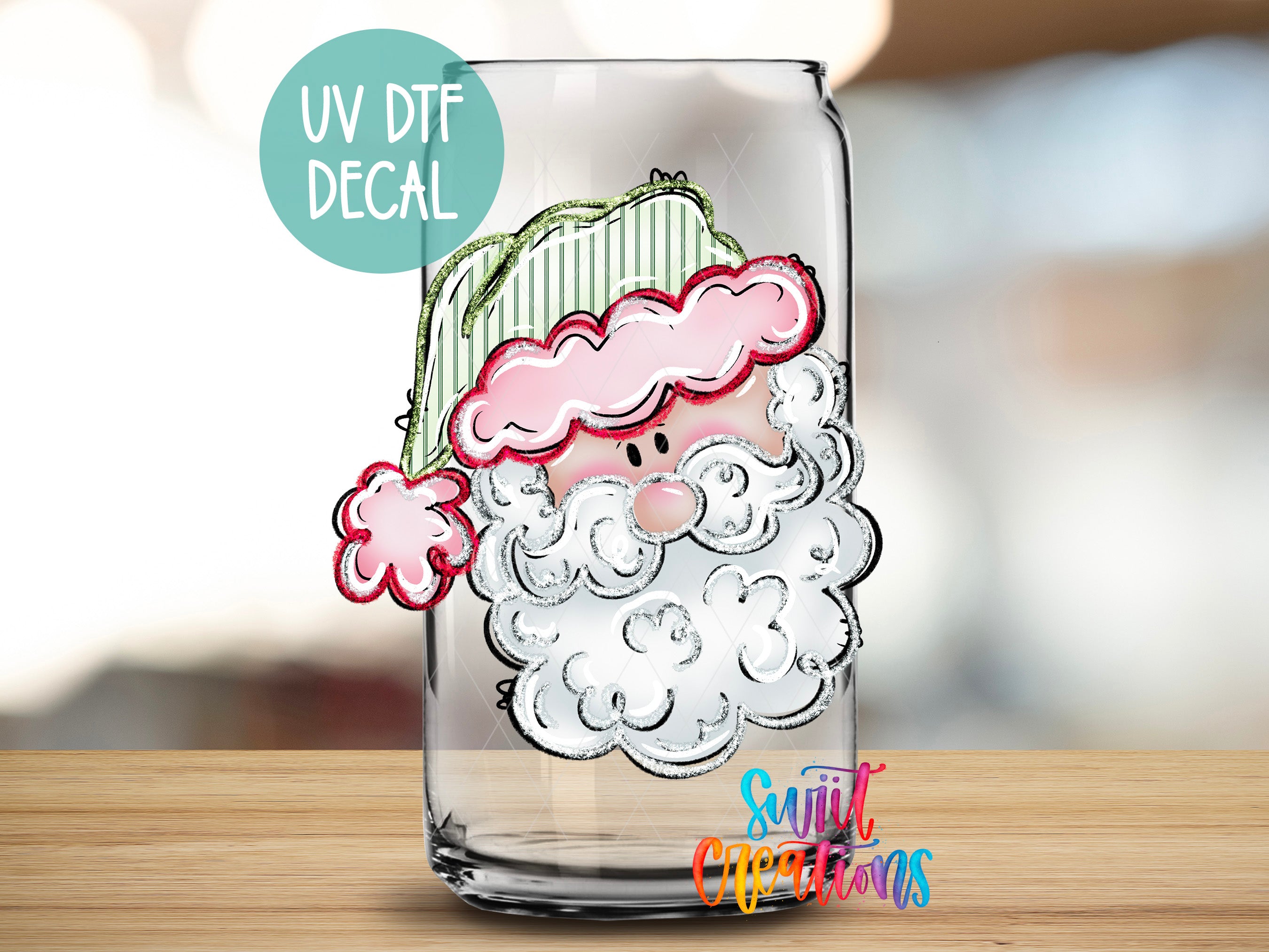 A glass jar with a cartoon Santa Claus face drawn on it, along with a UV decal and text indicating it is a "UV DTF DECAL".