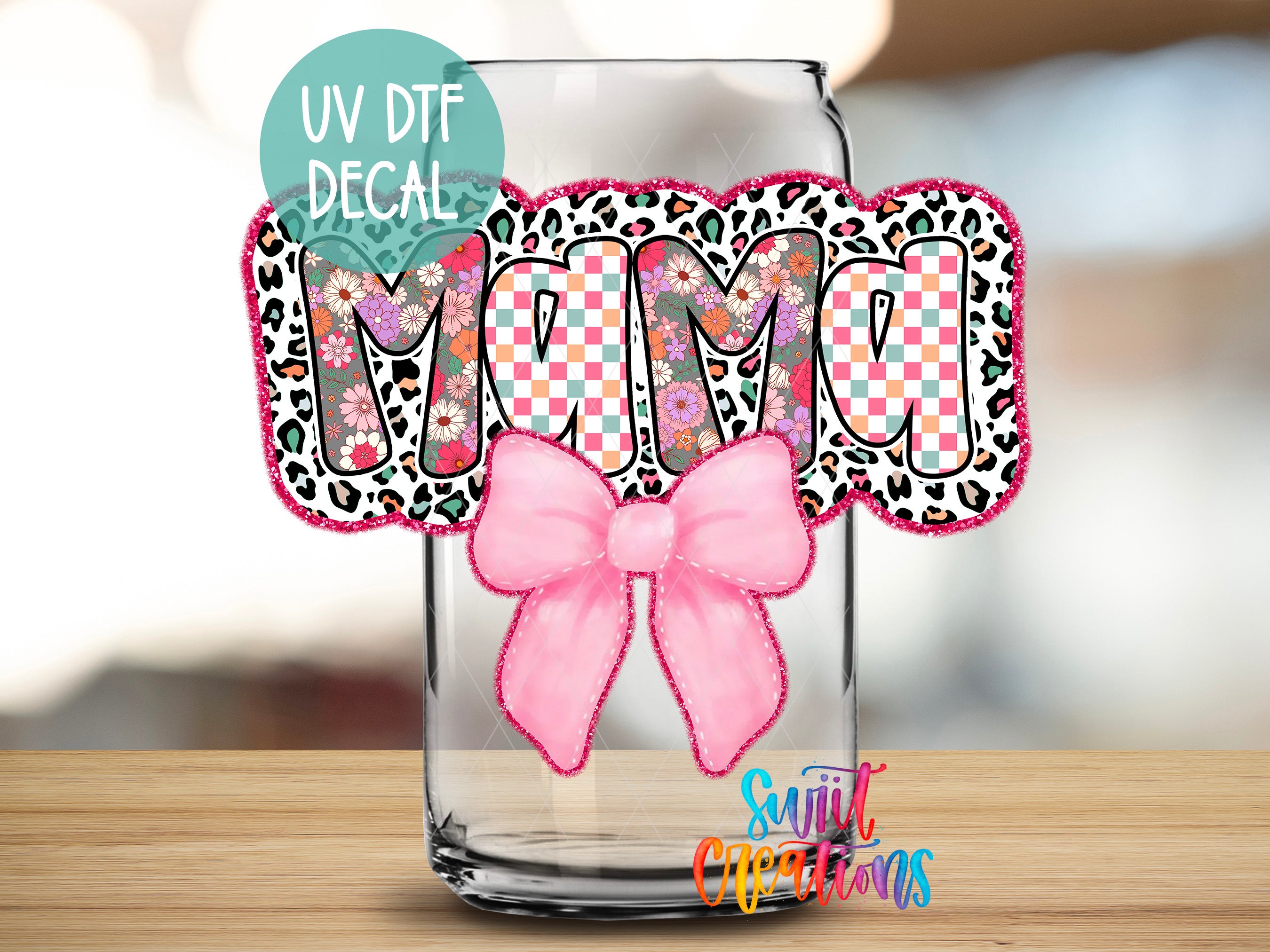 a mason jar with a pink bow on it