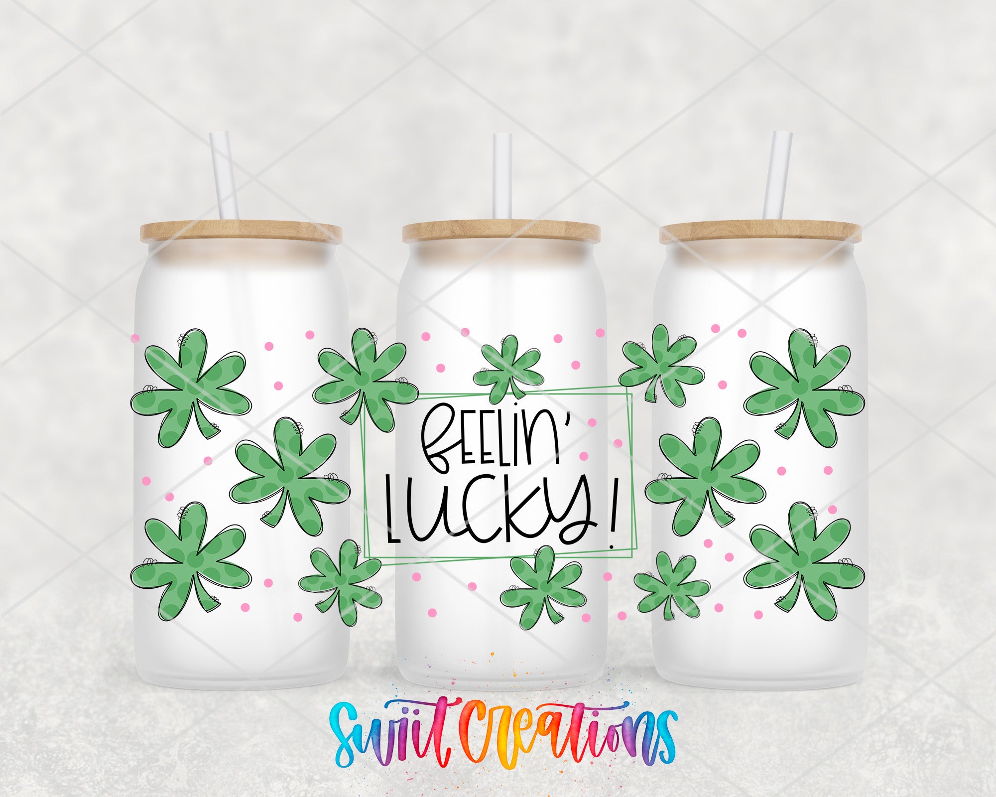 three white tumblers with green clover designs and the text "Feelin' Lucky!" written on them.