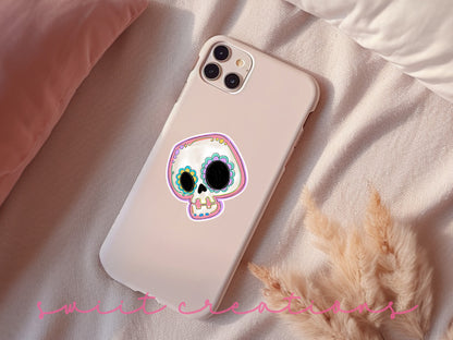 a phone case with a skull painted on it