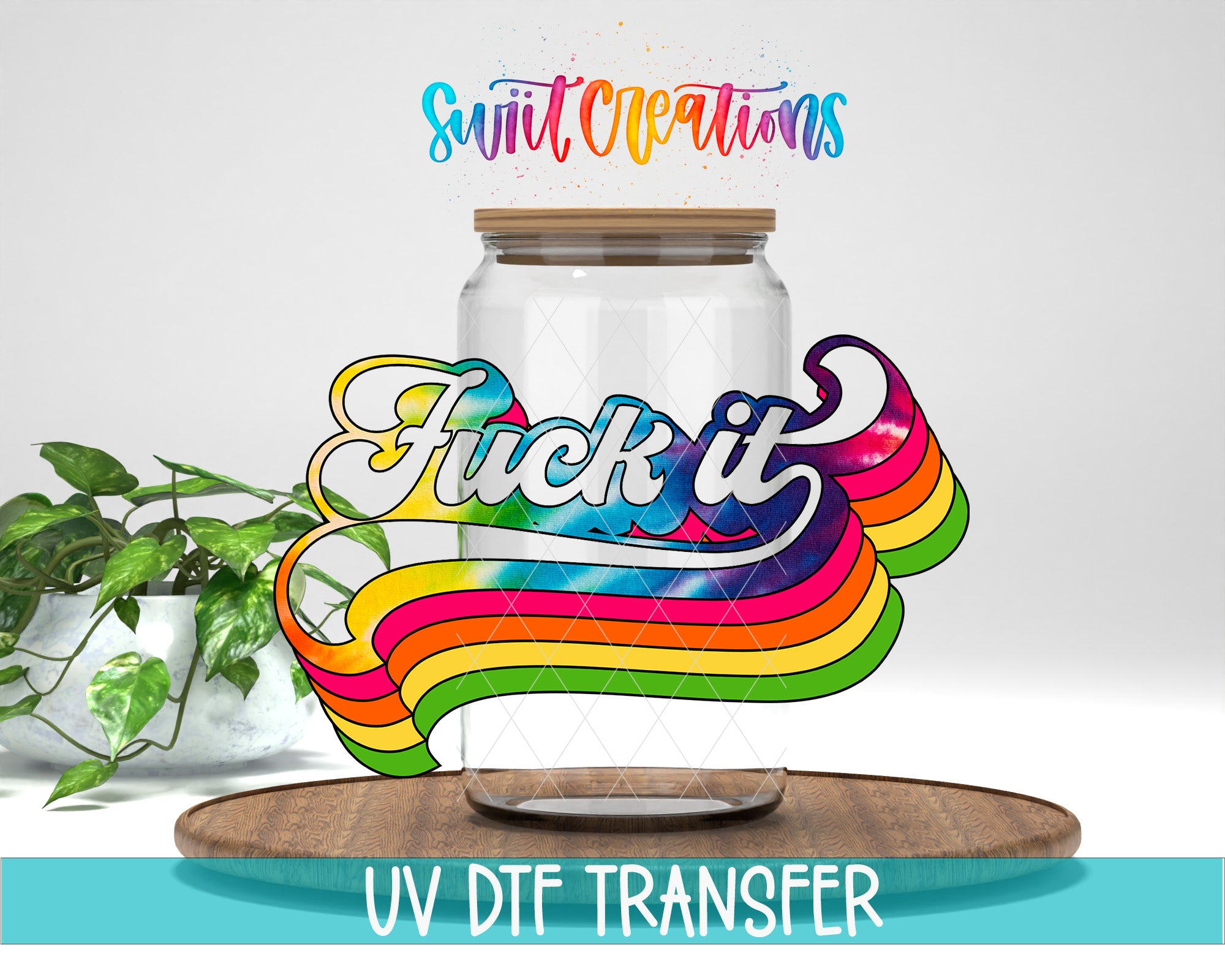 a jar with a colorful, rainbow-colored design and the text "FUCK IT" written on it. The jar is placed on a wooden surface, and there is a plant in the background.
