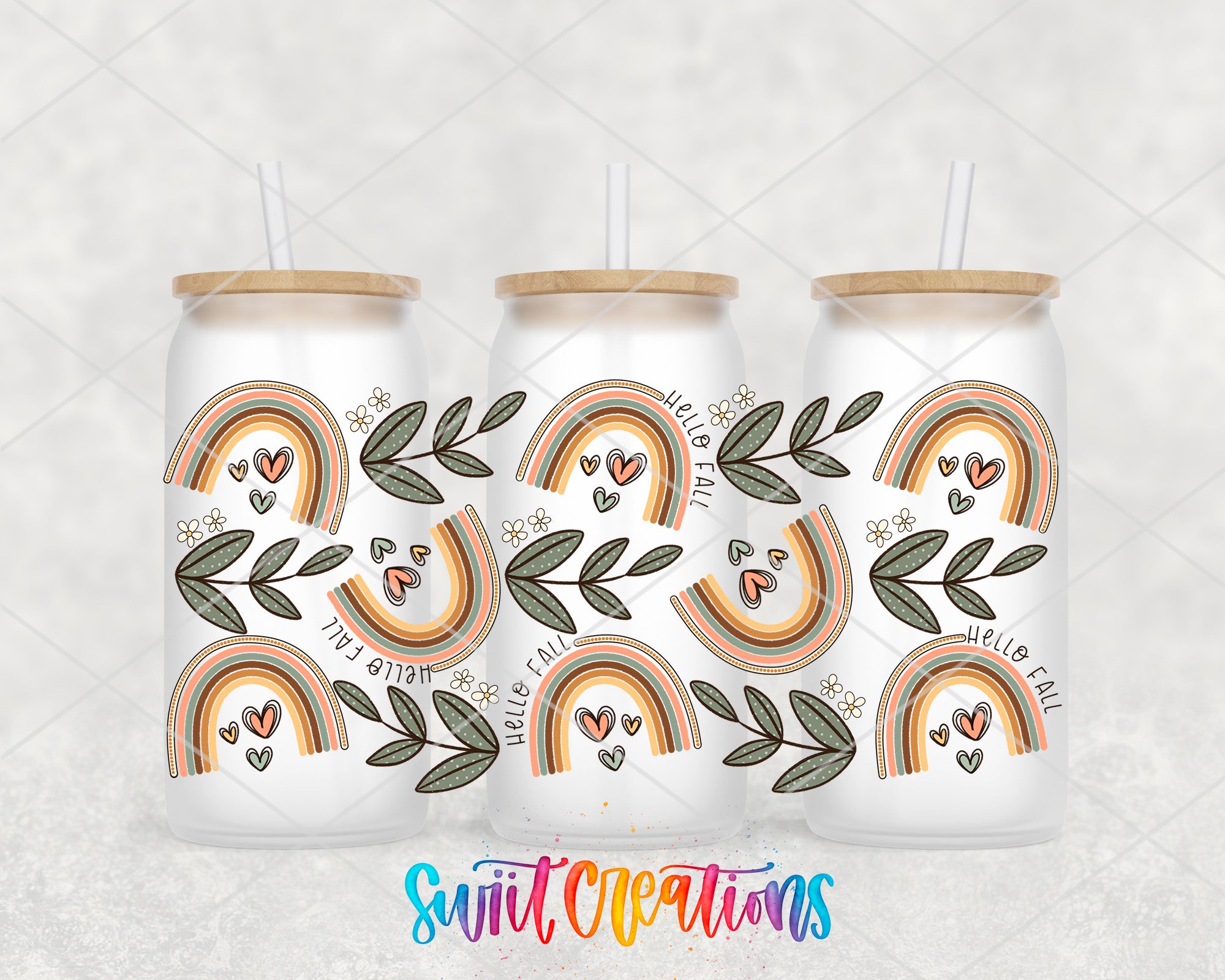 three white cans with a colorful, rainbow-themed design on them. The design includes various shades of green leaves and hearts, as well as multiple rainbow-colored arches. The cans have straws attached to the lids, and the background is a plain white color.