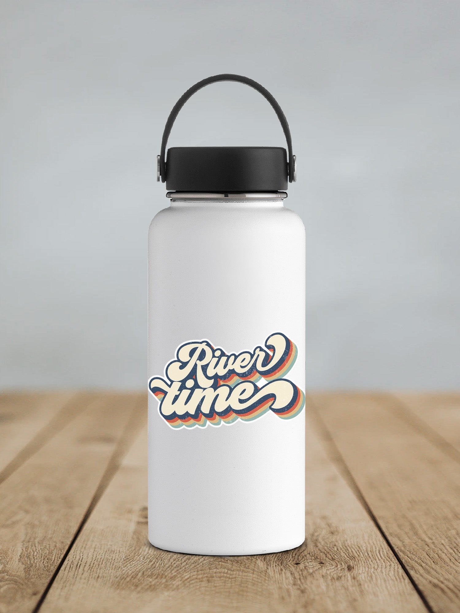a white water bottle sitting on top of a wooden table