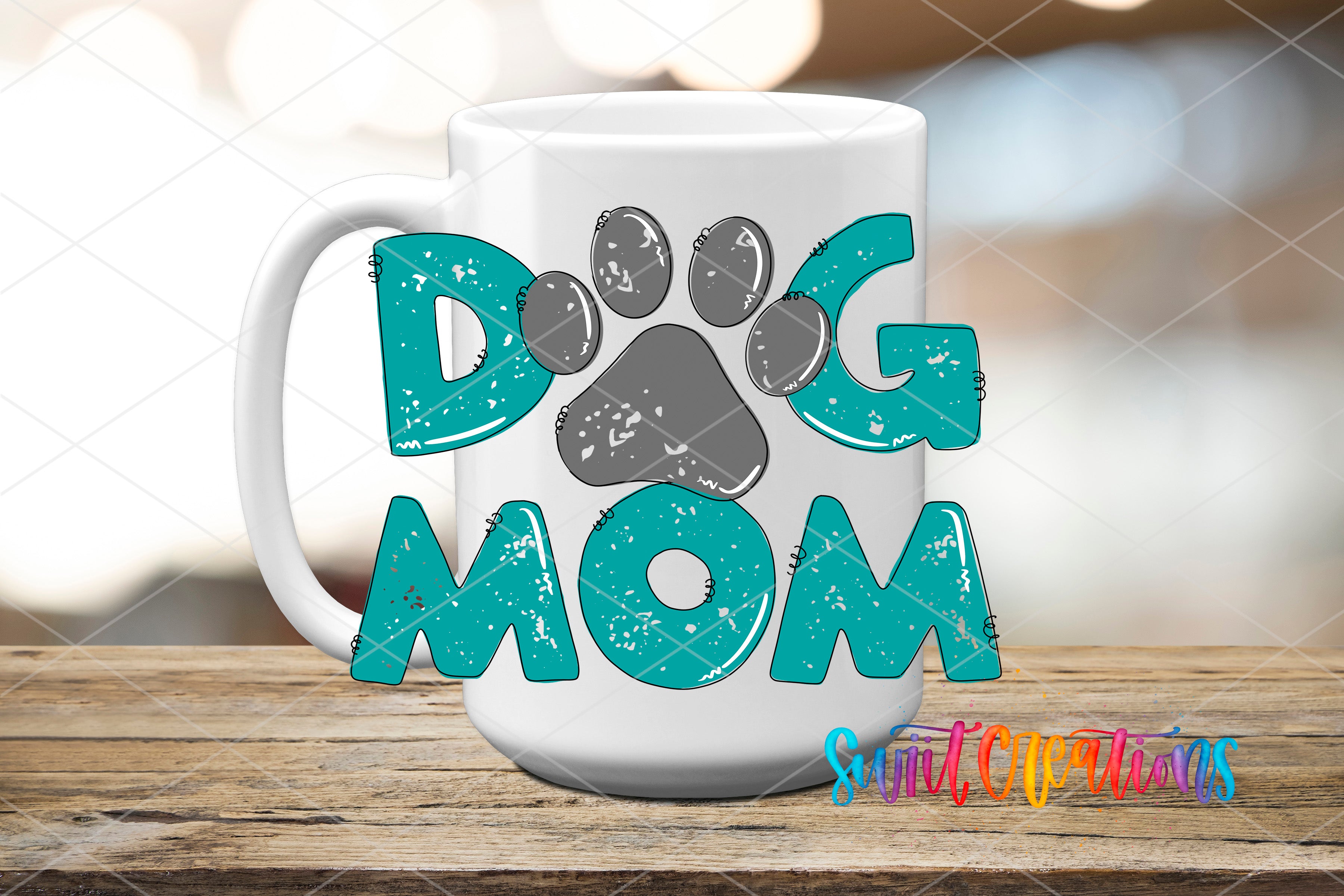 A white mug with the text "DOG MOM" printed on it, along with paw prints.