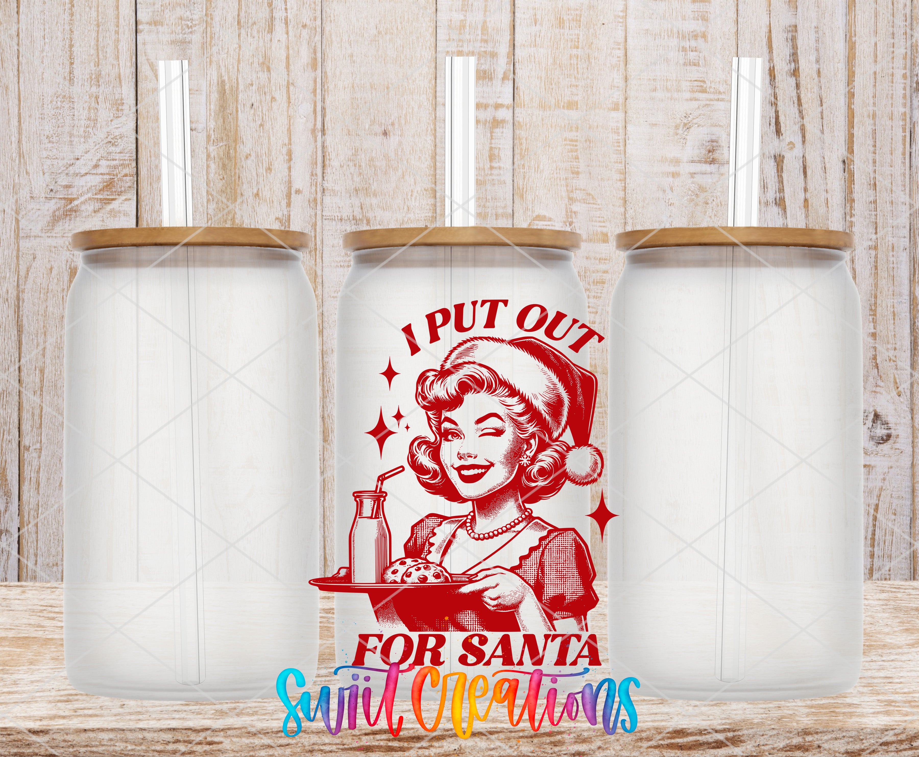 three clear glass jars with lids, each containing a straw. In the center of the image, there is a red and white illustration of a woman wearing a Santa hat and holding a tray of cookies. The text "I PUT OUT FOR SANTA" is displayed in a colorful font, and the phrase "Sweet Cleanliness" is written below the illustration.