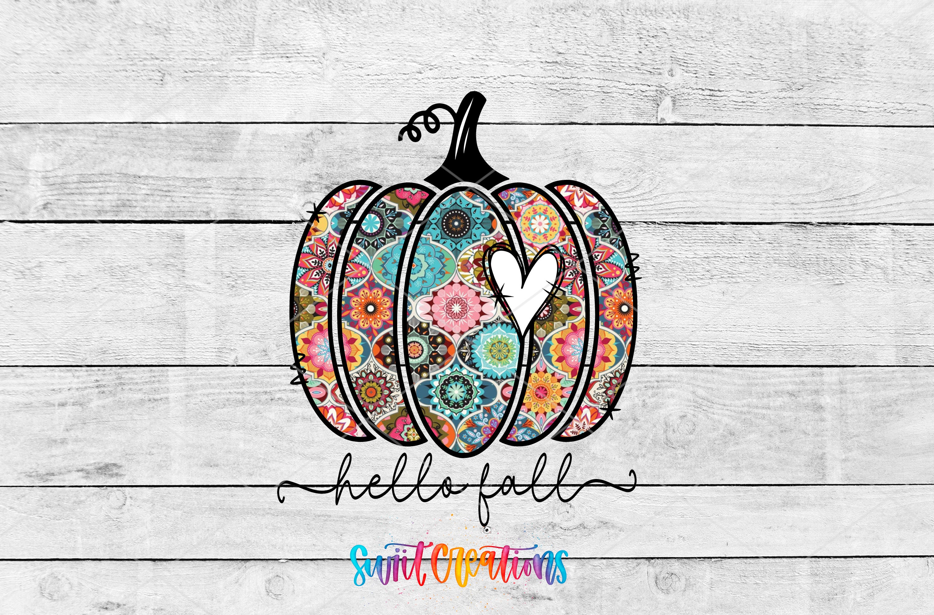 A colorful pumpkin with a heart cut out of it, set against a white wooden background. The text "Hello fall" is written below the pumpkin.