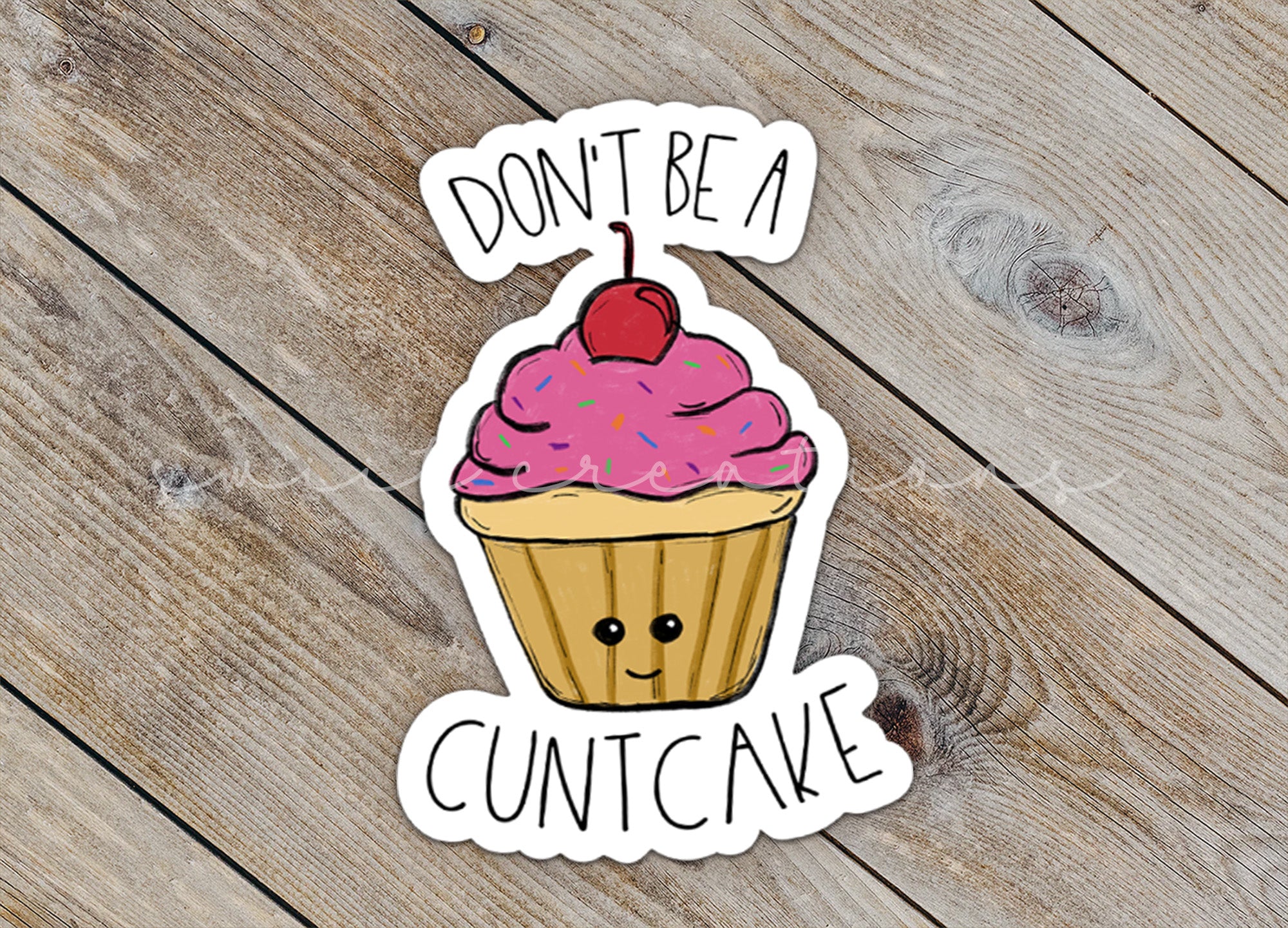 a sticker of a cupcake with a cherry on top