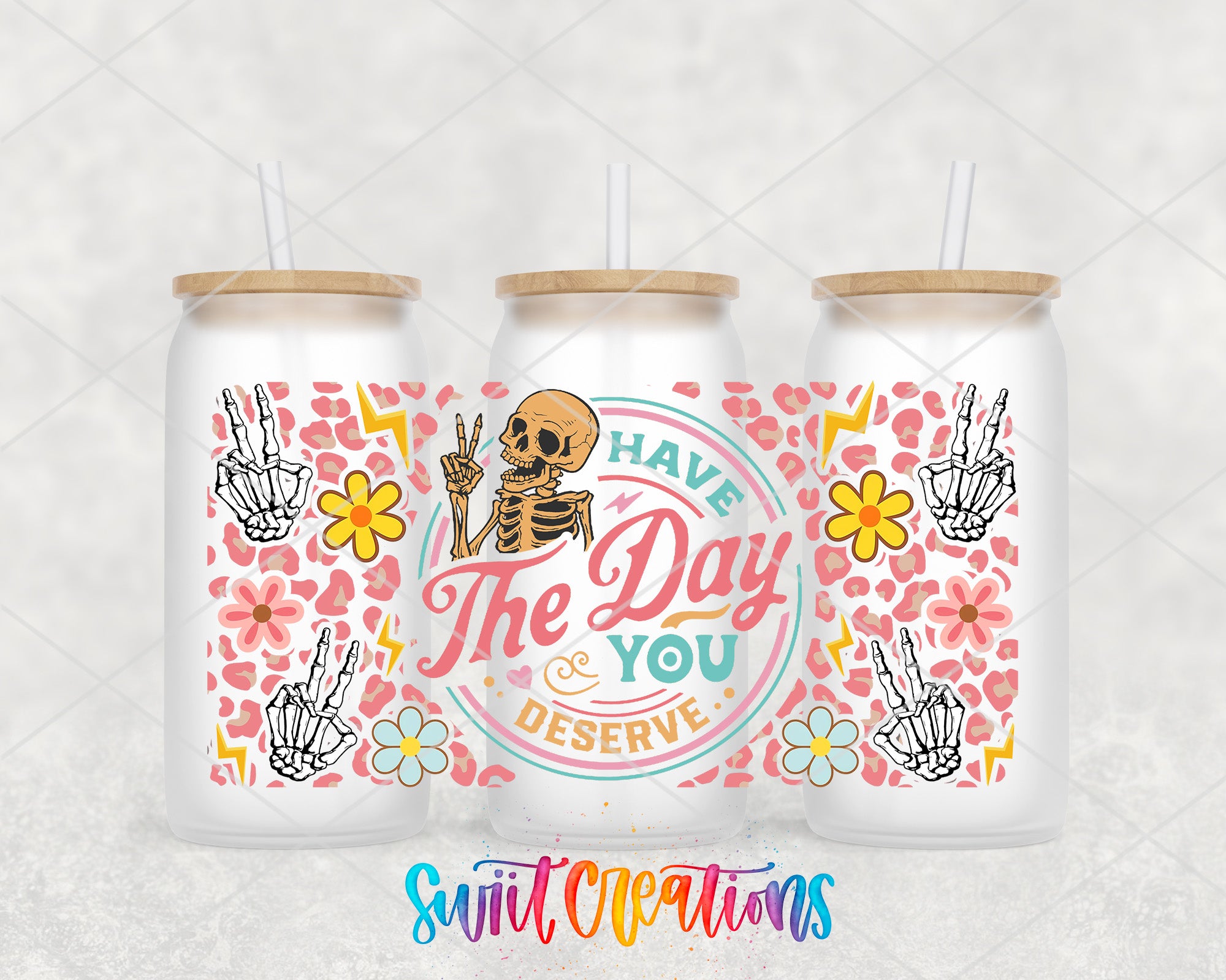 three white tumblers with colorful designs and text on them.