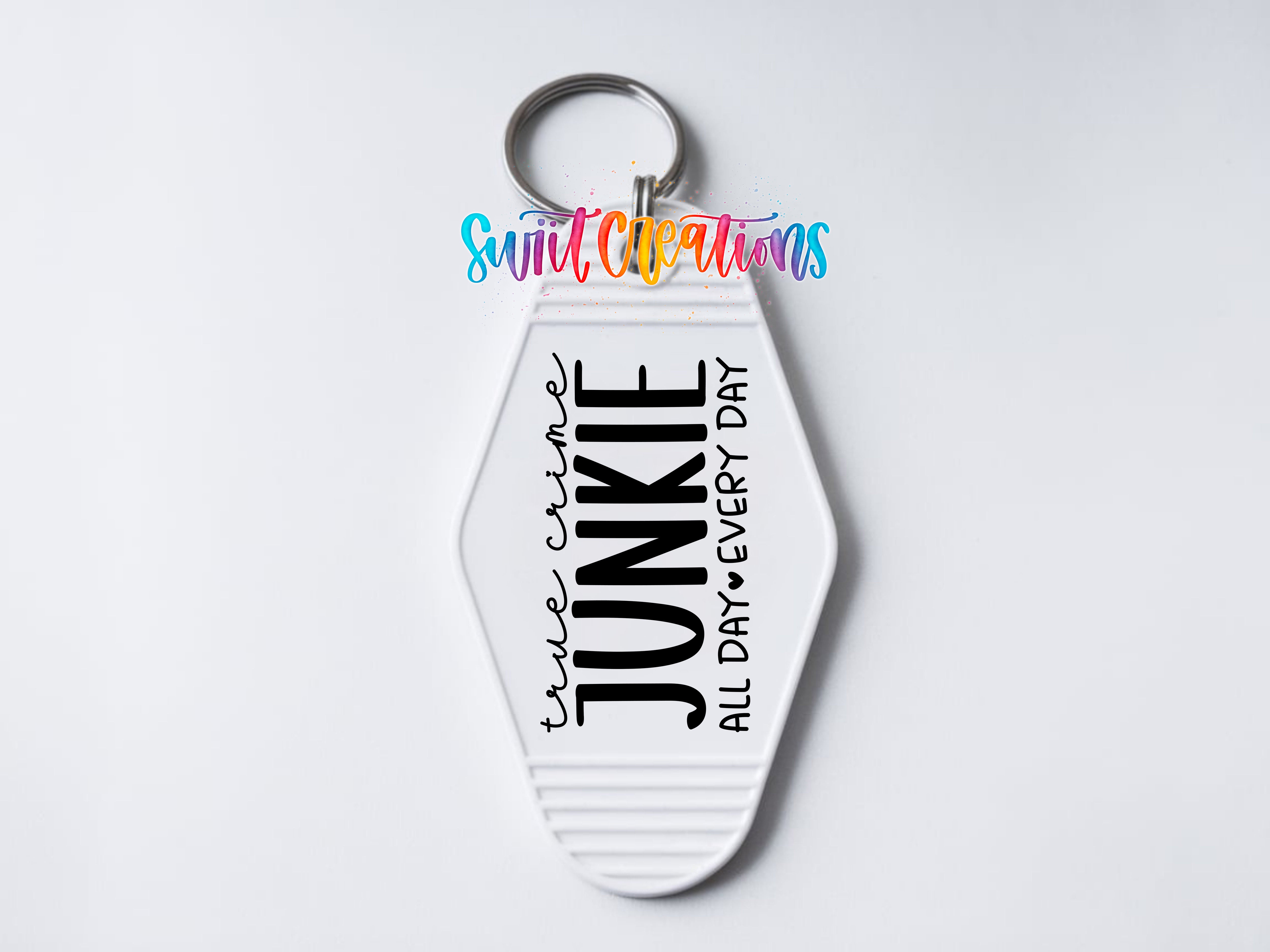 A keychain with the text "JUNKIE ALL DAY EVERY DAY" printed on it.