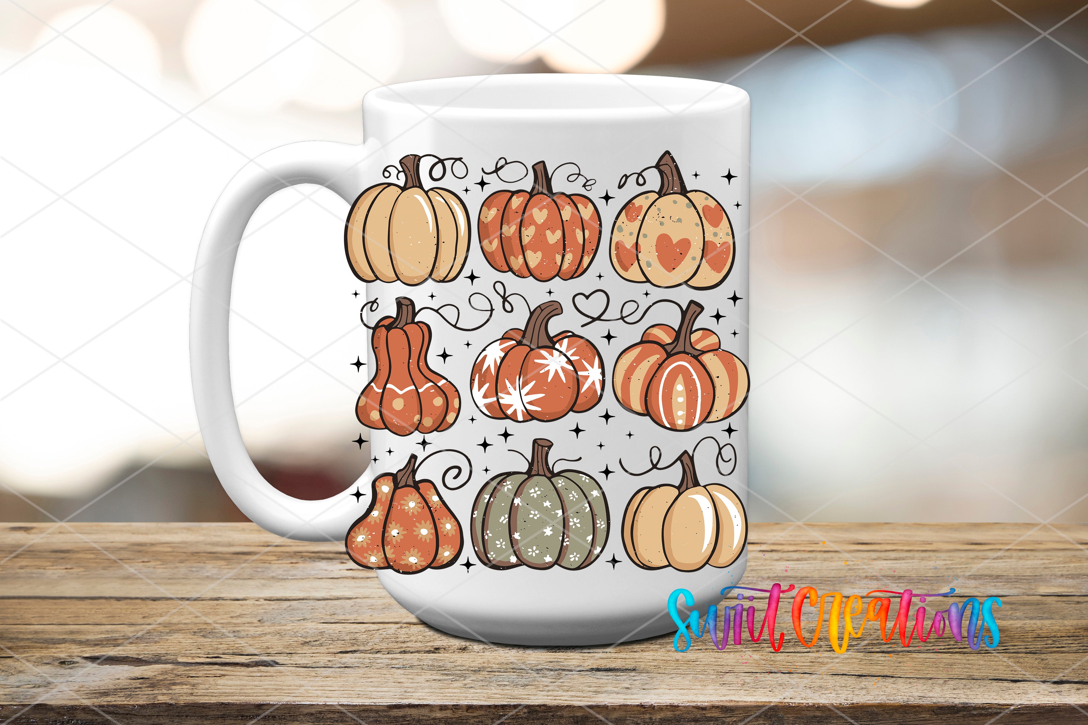A white mug with a design of various pumpkins and decorative elements, including hearts and stars, printed on it.