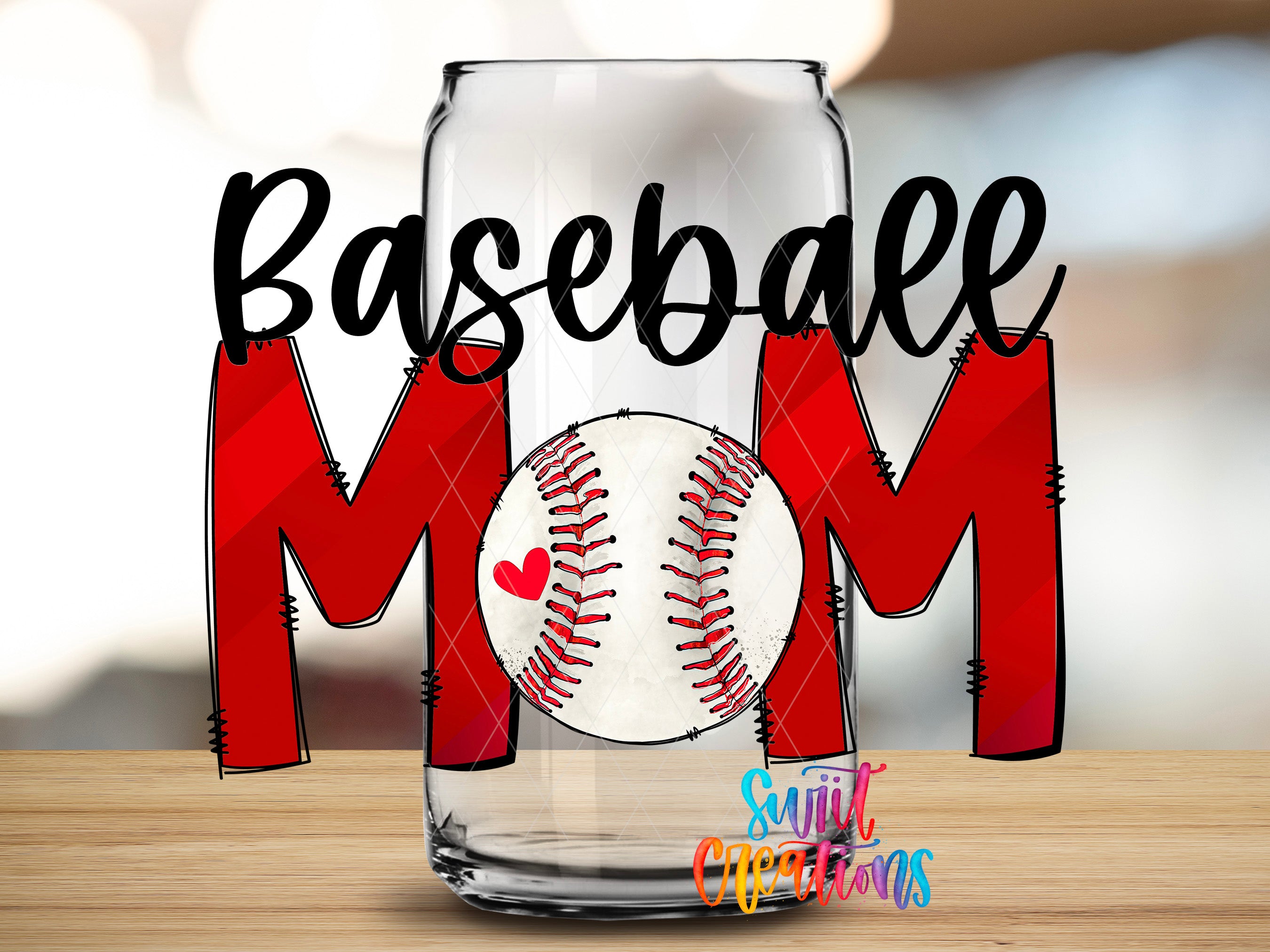 A glass can with the word "Baseball Mom" written on it, along with a baseball graphic inside the can.